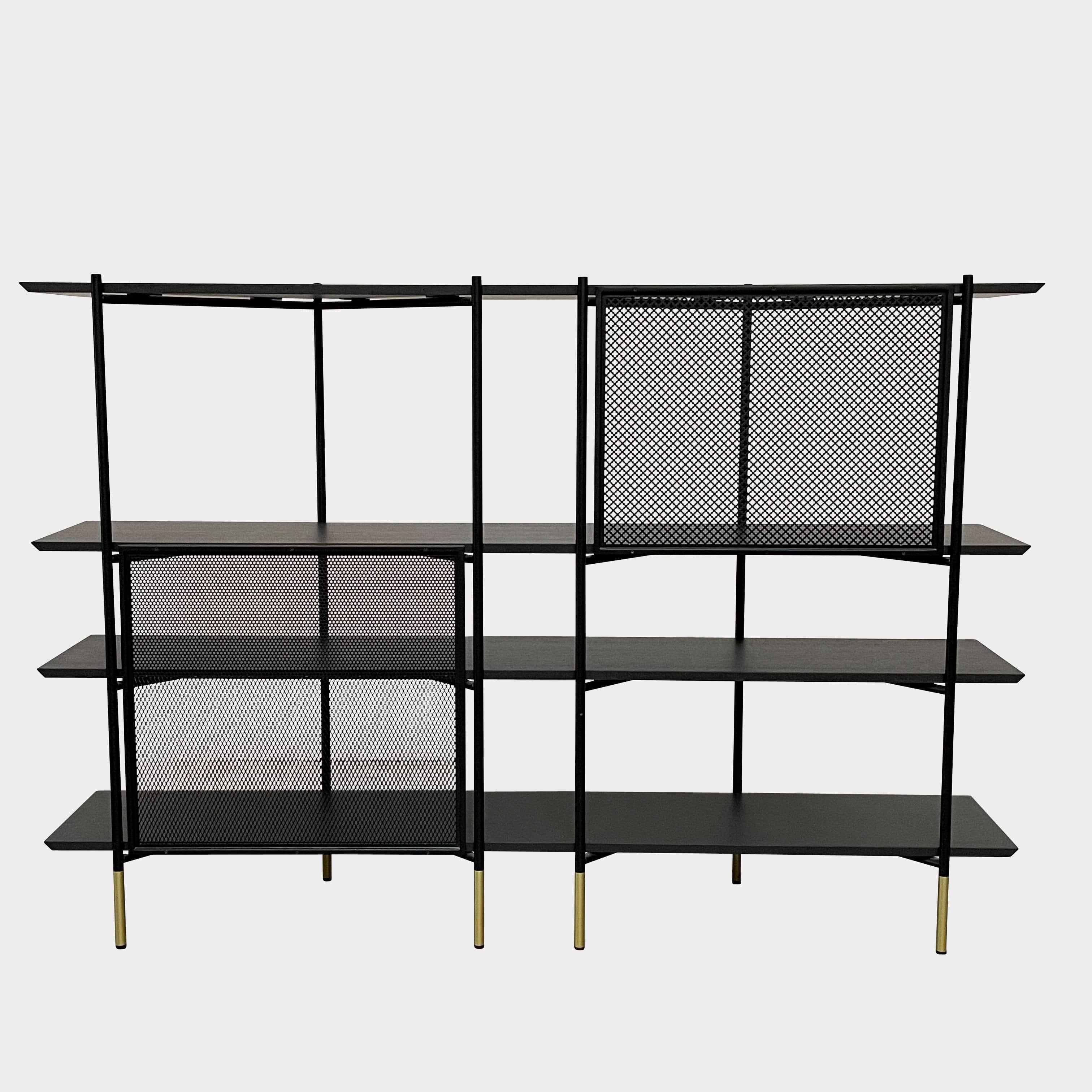 A Ligne Roset Clyde Bookcase with a mesh back.