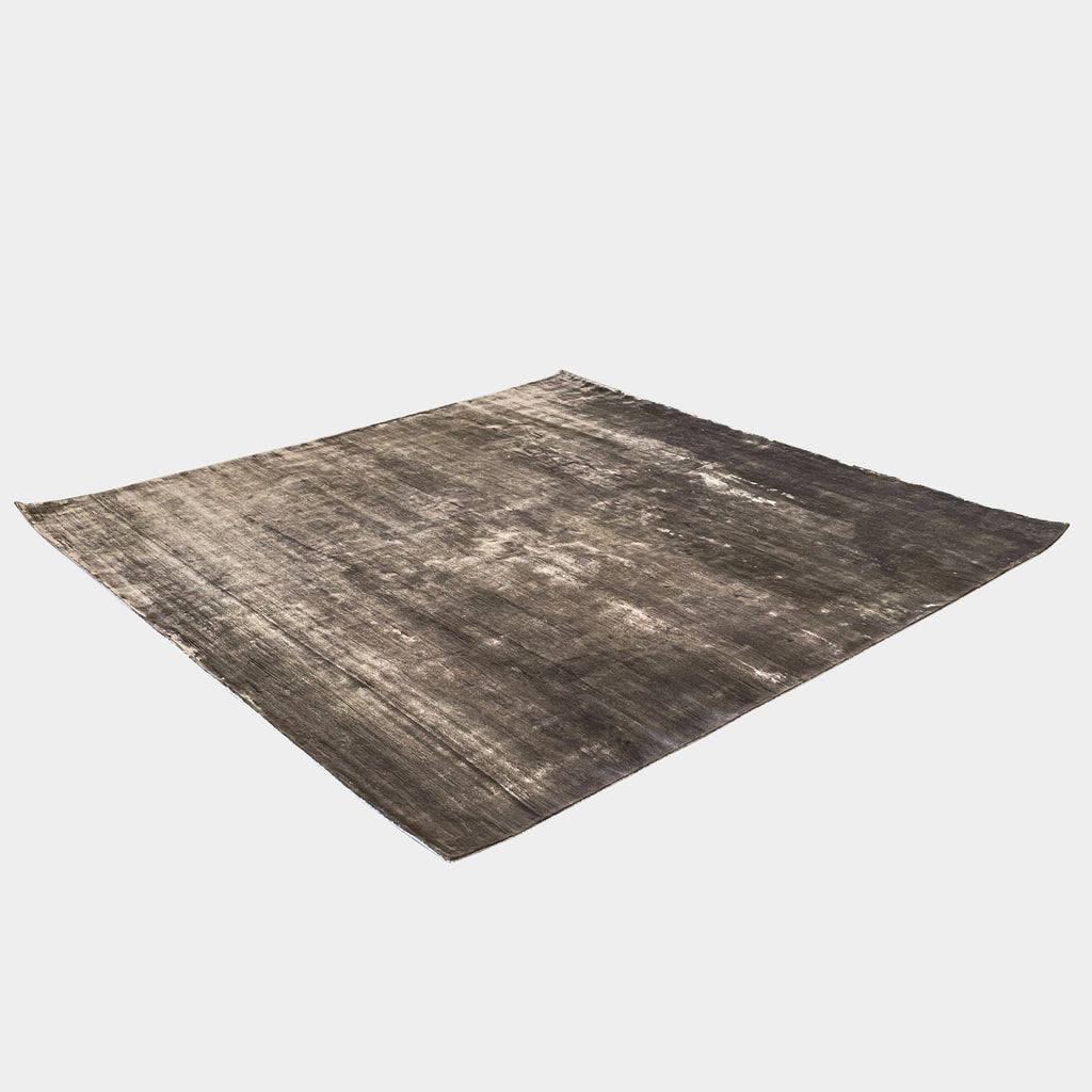 A Delinear Bamboo 7'X7' Rug with a grey background.