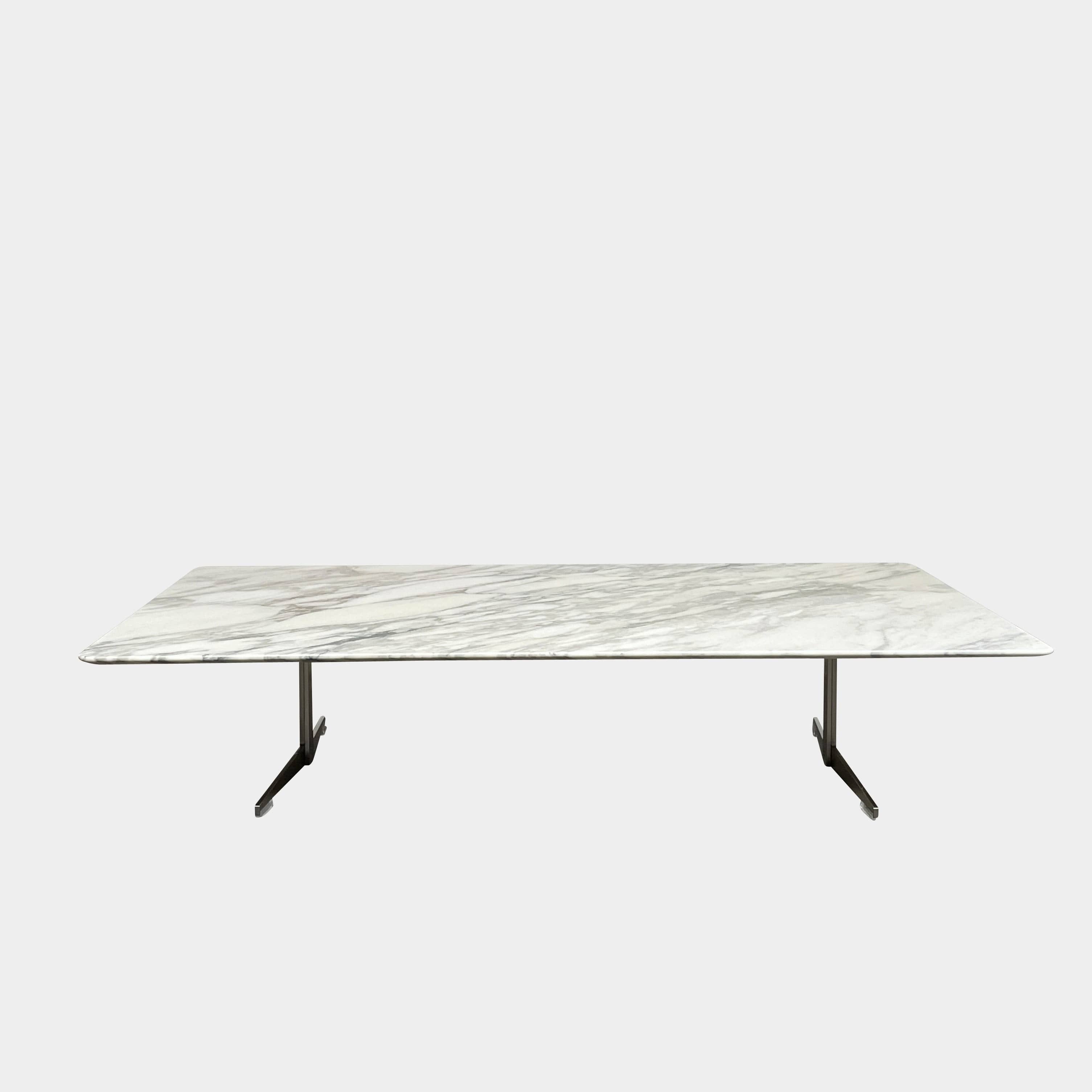 A Flexform Fly Marble Coffee Table with black legs on a white background.