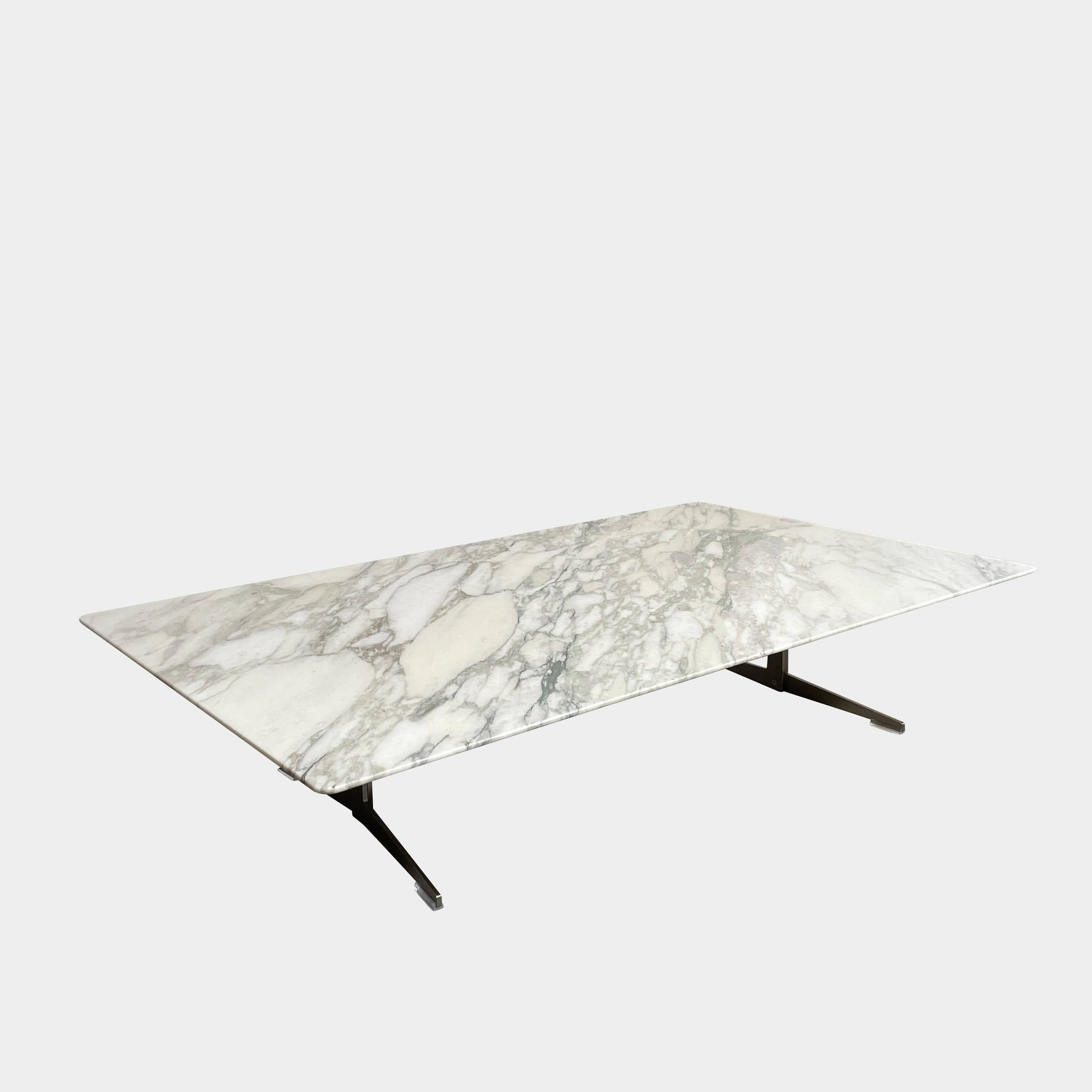 A Flexform Fly Marble Coffee Table with black legs on a white background.