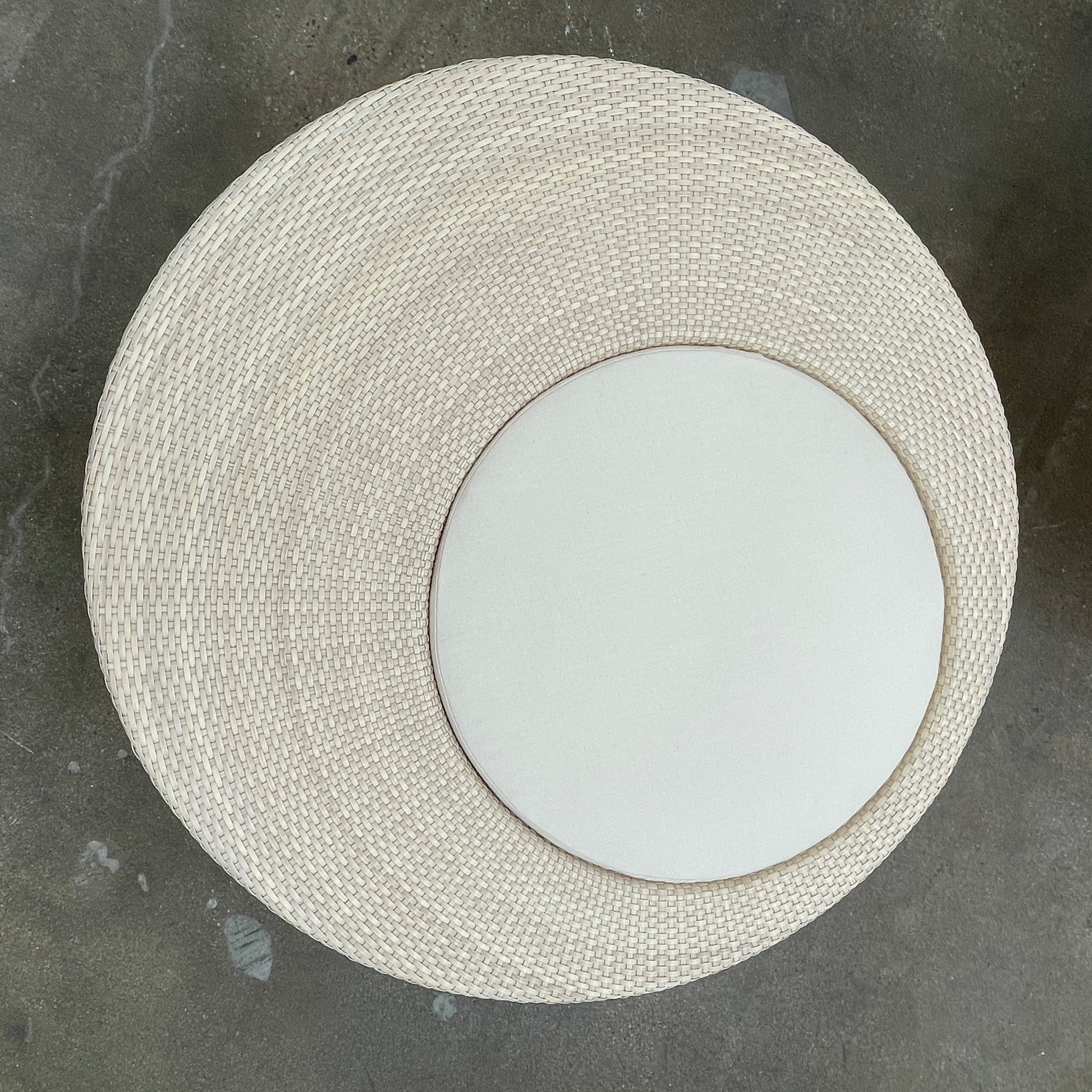 Experience the elegance of Richard Frinier Design with Dedon's Orbit Swivel Sofa Set, including a curved sofa with an adjustable canopy, ottoman, and side table. Cream-colored cushions add style and comfort to your outdoor ensemble.