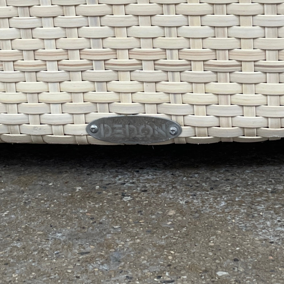 Experience the elegance of Richard Frinier Design with Dedon's Orbit Swivel Sofa Set, including a curved sofa with an adjustable canopy, ottoman, and side table. Cream-colored cushions add style and comfort to your outdoor ensemble.