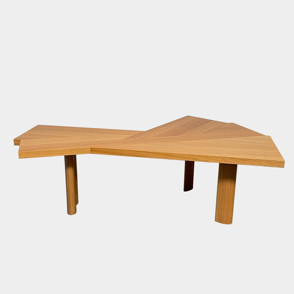 A Cassina Ventaglio Table with a curved shape.