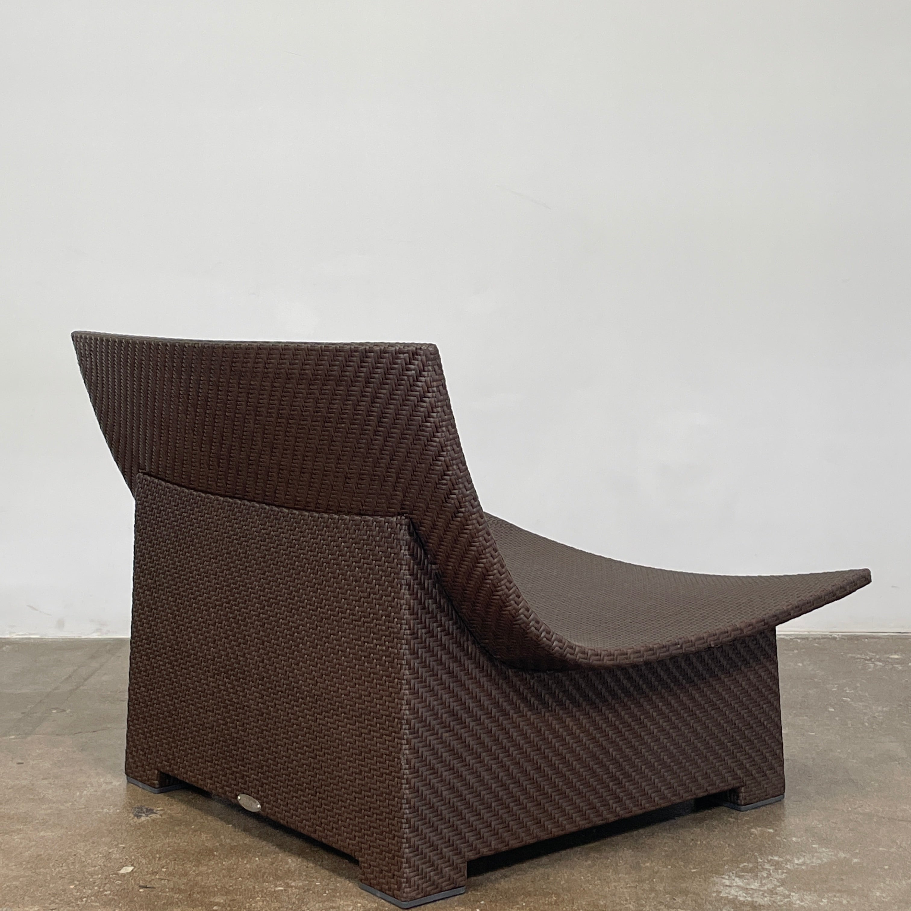 The Dedon Spa Outdoor Lounge Chairs set features two cream-cushioned seats made with proprietary fiber, beautifully displayed side by side against a simple white backdrop.