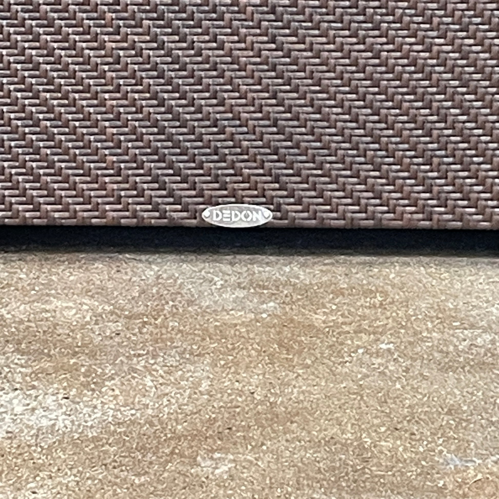 The Dedon Spa Outdoor Lounge Chairs set features two cream-cushioned seats made with proprietary fiber, beautifully displayed side by side against a simple white backdrop.