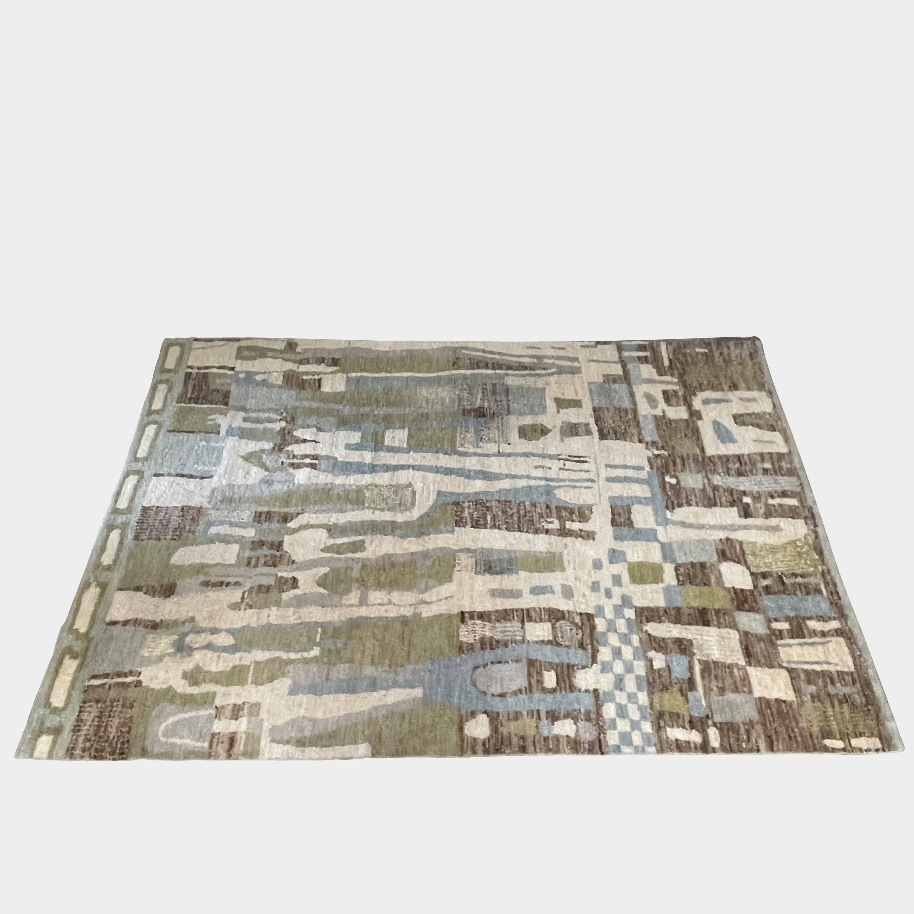 A Handmade Pakistan Design 9' x 13' Rug with brown, blue, and green squares on a white background.