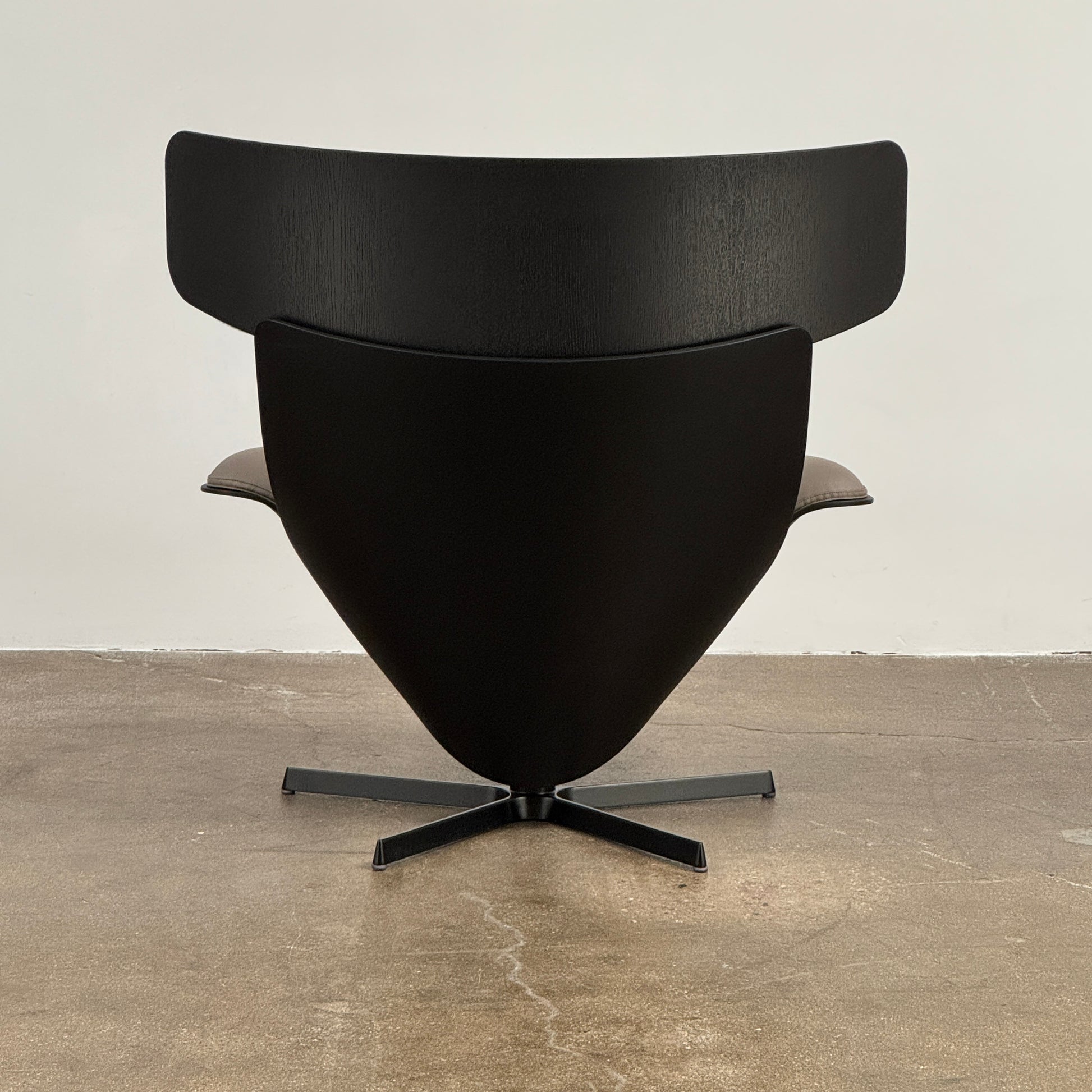 The B&B Italia Almora Chair and Ottoman in modern gray and black are swivel lounge pieces by B&B Italia, displayed on a white background.