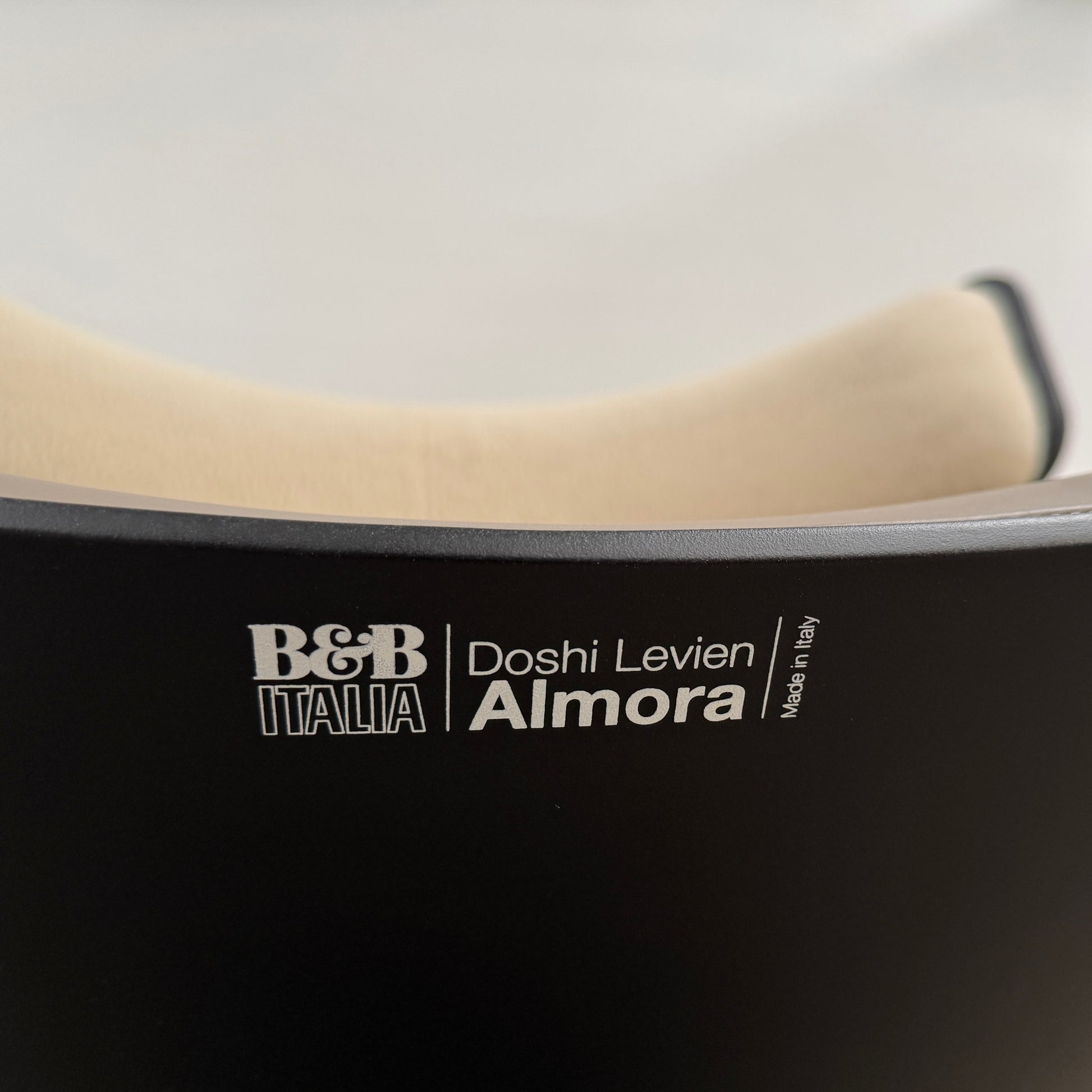 The B&B Italia Almora Chair and Ottoman in modern gray and black are swivel lounge pieces by B&B Italia, displayed on a white background.