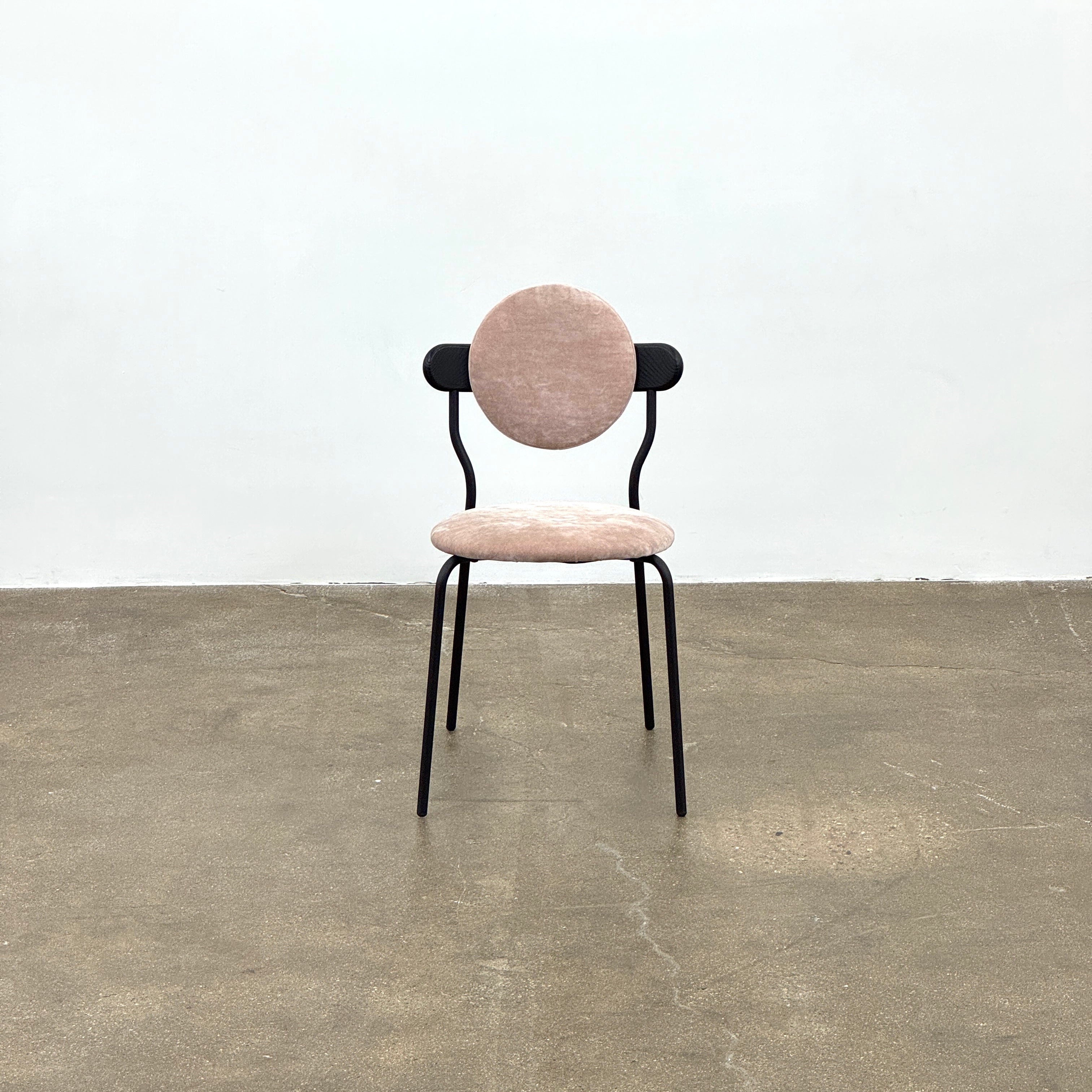Set of 6 La Chance Planet Dining Chairs featuring round beige cushions, black metal legs, and black circular back accents. Arranged in two rows on a plain background and inspired by La Chance’s contemporary elegance.