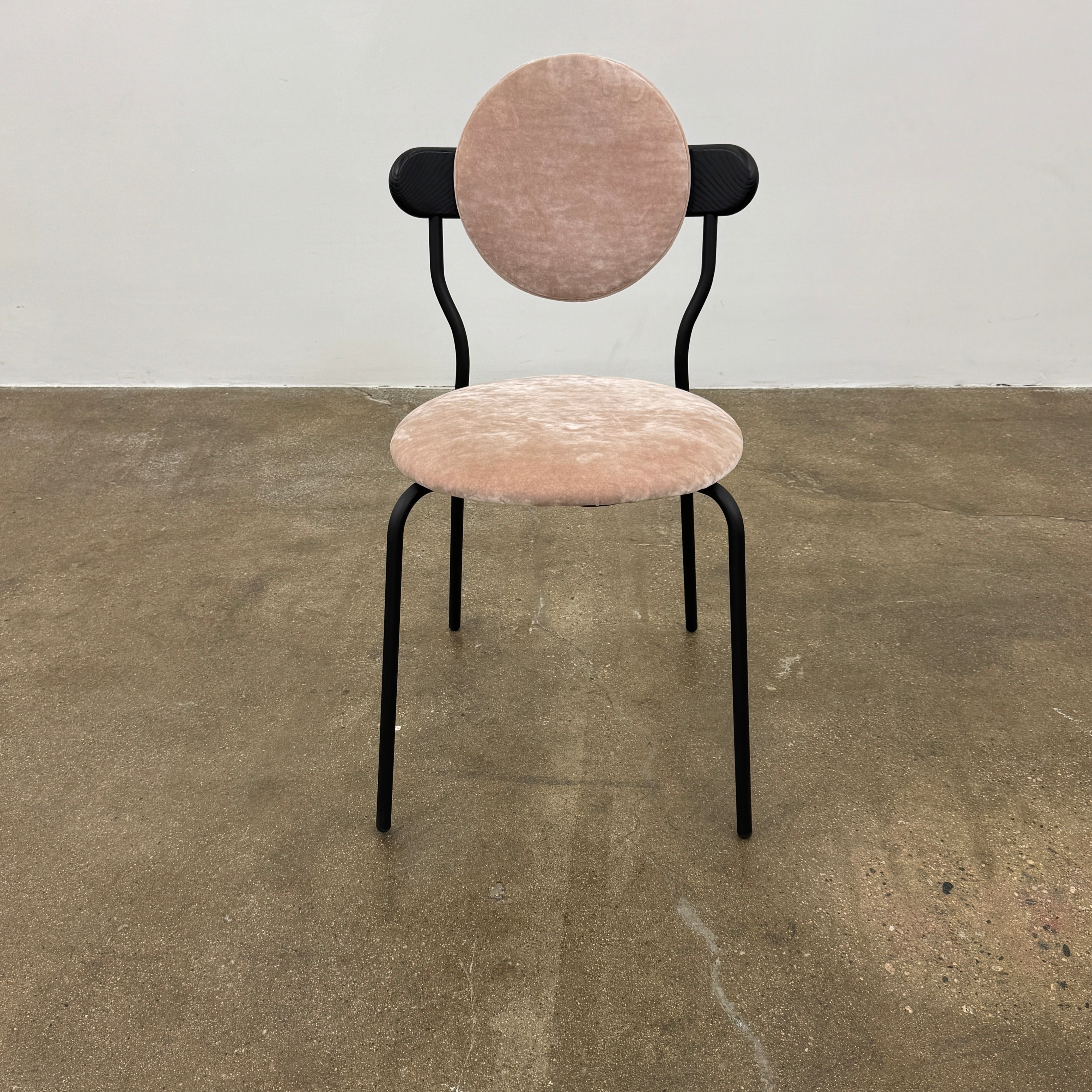 Set of 6 La Chance Planet Dining Chairs featuring round beige cushions, black metal legs, and black circular back accents. Arranged in two rows on a plain background and inspired by La Chance’s contemporary elegance.