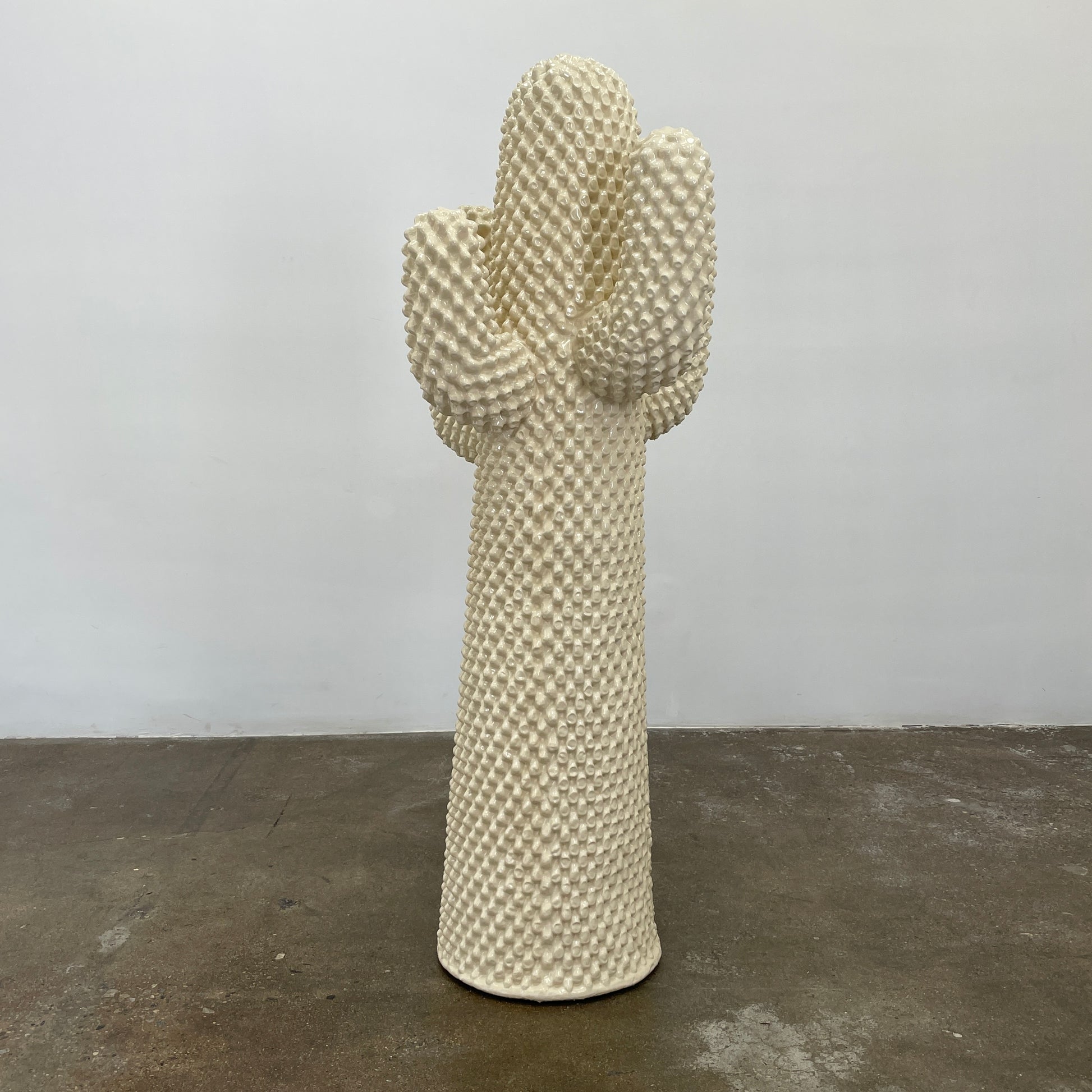 The Gufram Another White Cactus Coat Stand / Sculpture, a textured white piece inspired by iconic Italian design, stands upright against a plain white background.