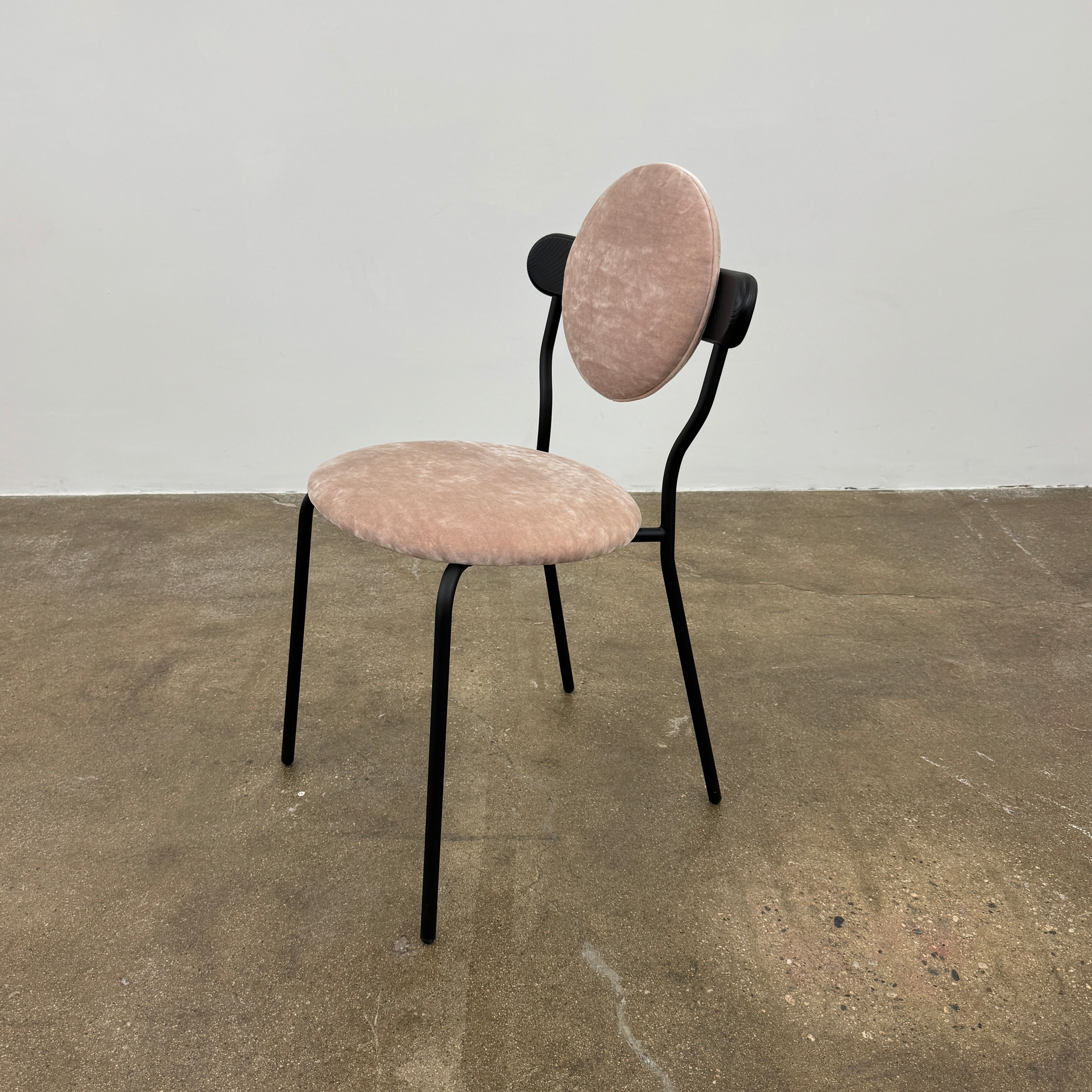 Set of 6 La Chance Planet Dining Chairs featuring round beige cushions, black metal legs, and black circular back accents. Arranged in two rows on a plain background and inspired by La Chance’s contemporary elegance.