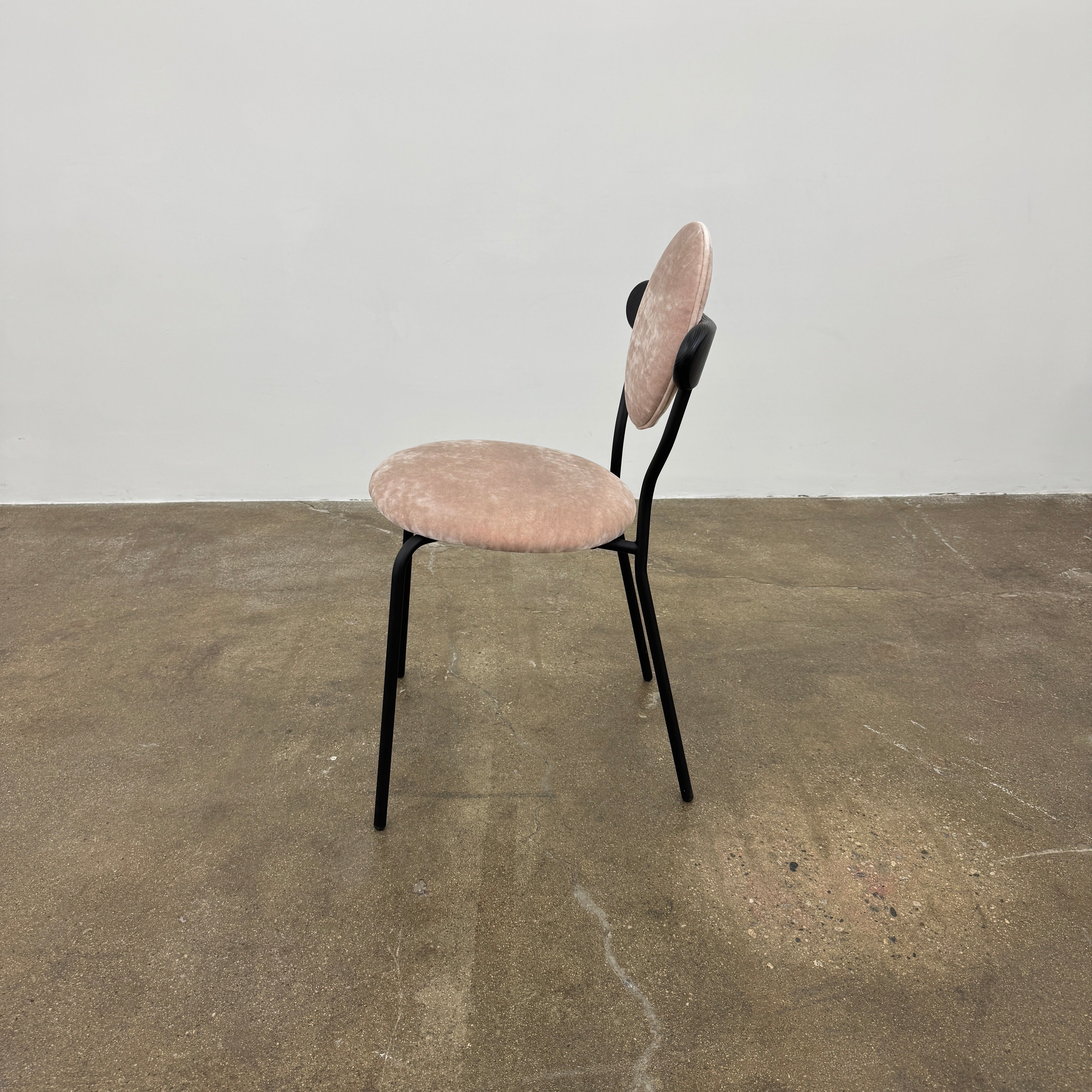 Set of 6 La Chance Planet Dining Chairs featuring round beige cushions, black metal legs, and black circular back accents. Arranged in two rows on a plain background and inspired by La Chance’s contemporary elegance.