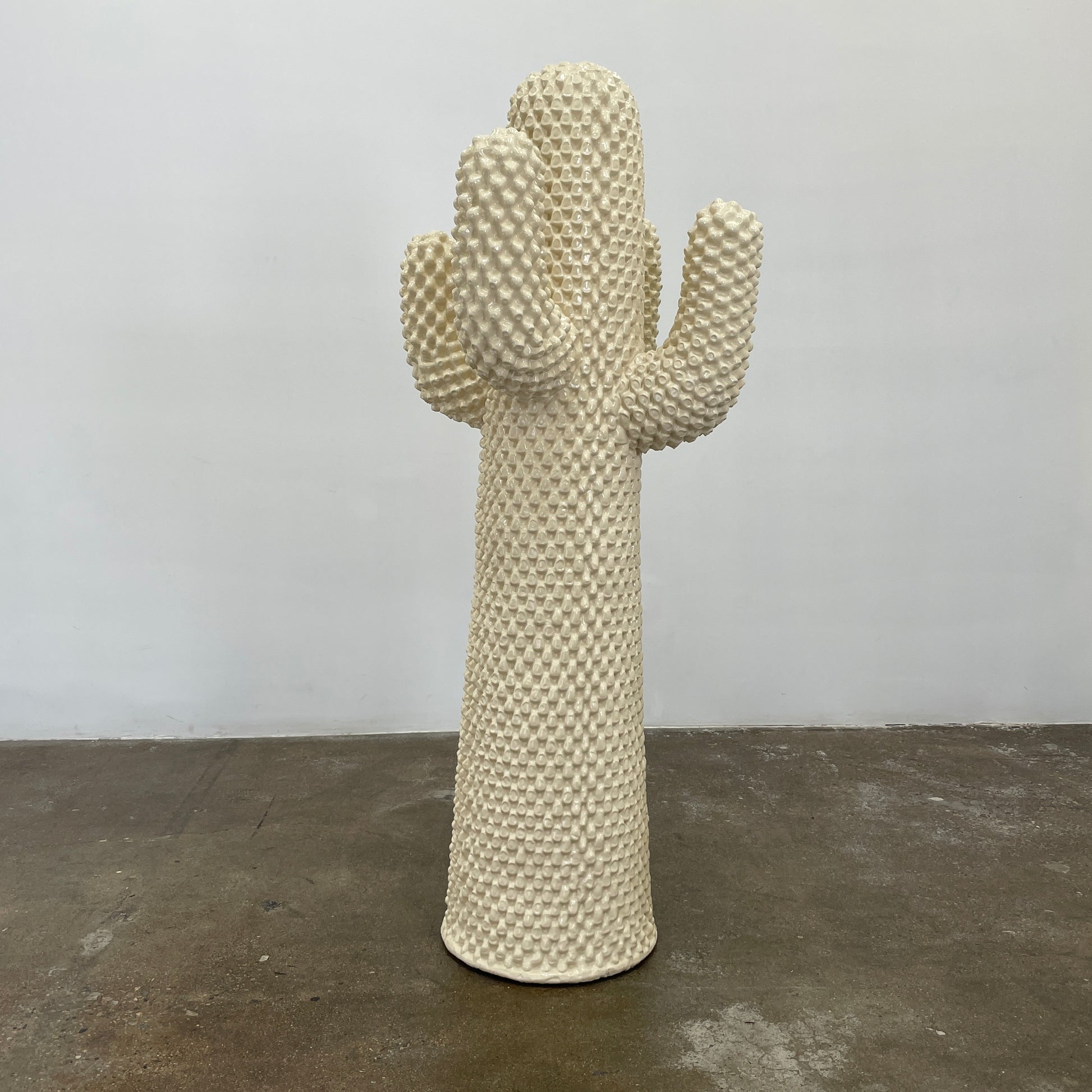 The Gufram Another White Cactus Coat Stand / Sculpture, a textured white piece inspired by iconic Italian design, stands upright against a plain white background.