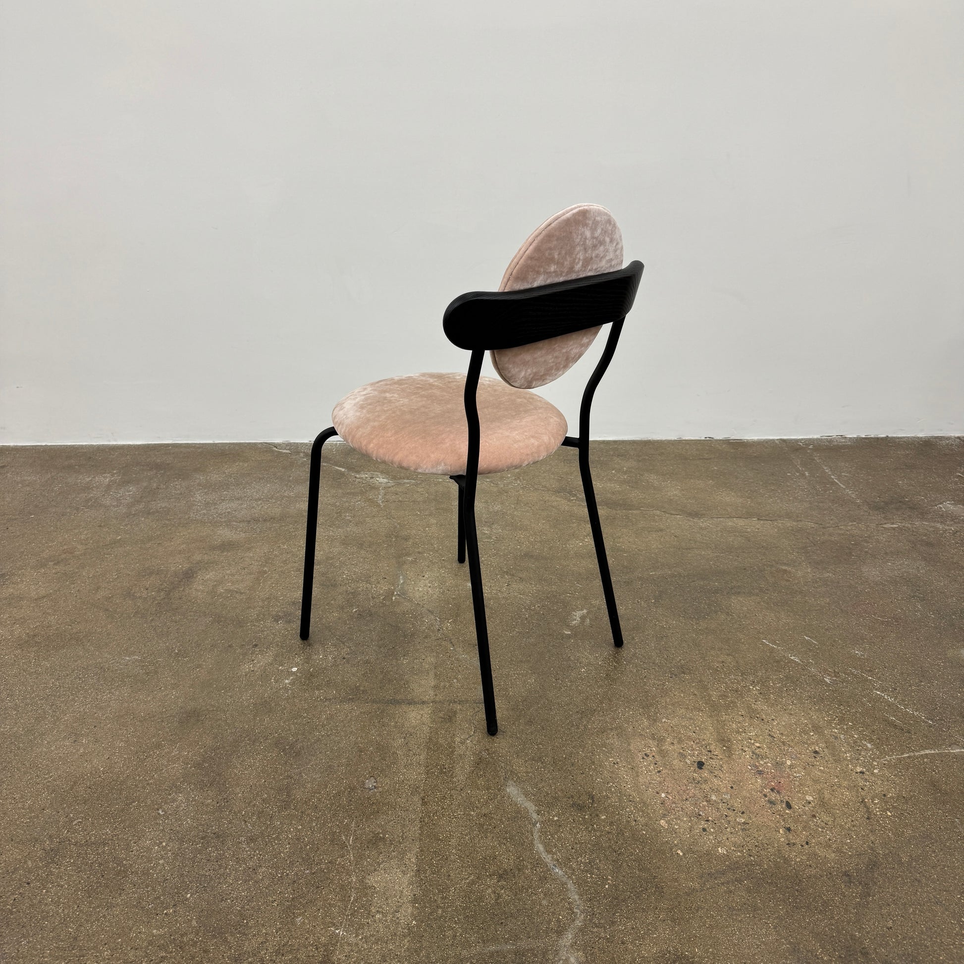 Set of 6 La Chance Planet Dining Chairs featuring round beige cushions, black metal legs, and black circular back accents. Arranged in two rows on a plain background and inspired by La Chance’s contemporary elegance.