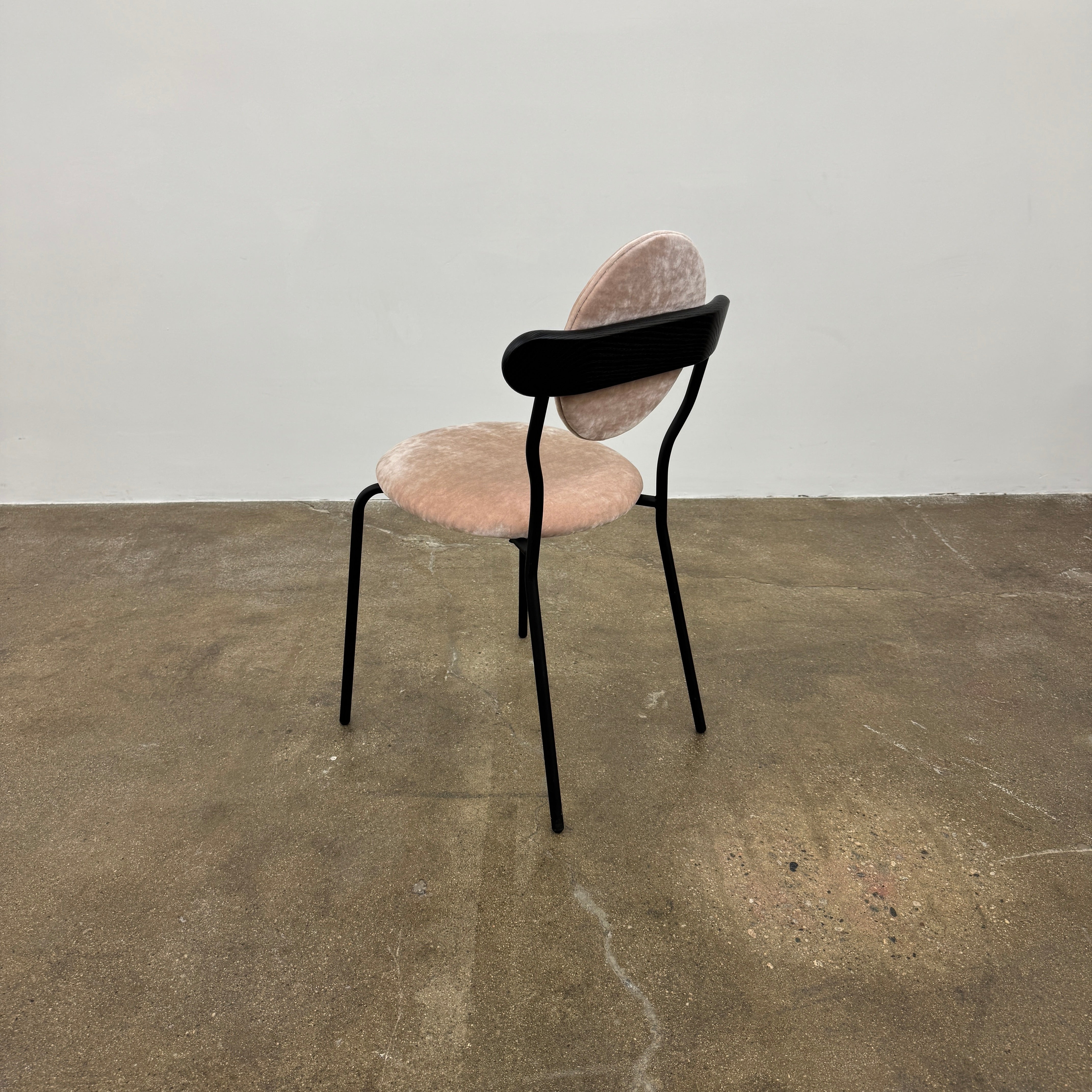 Set of 6 La Chance Planet Dining Chairs featuring round beige cushions, black metal legs, and black circular back accents. Arranged in two rows on a plain background and inspired by La Chance’s contemporary elegance.