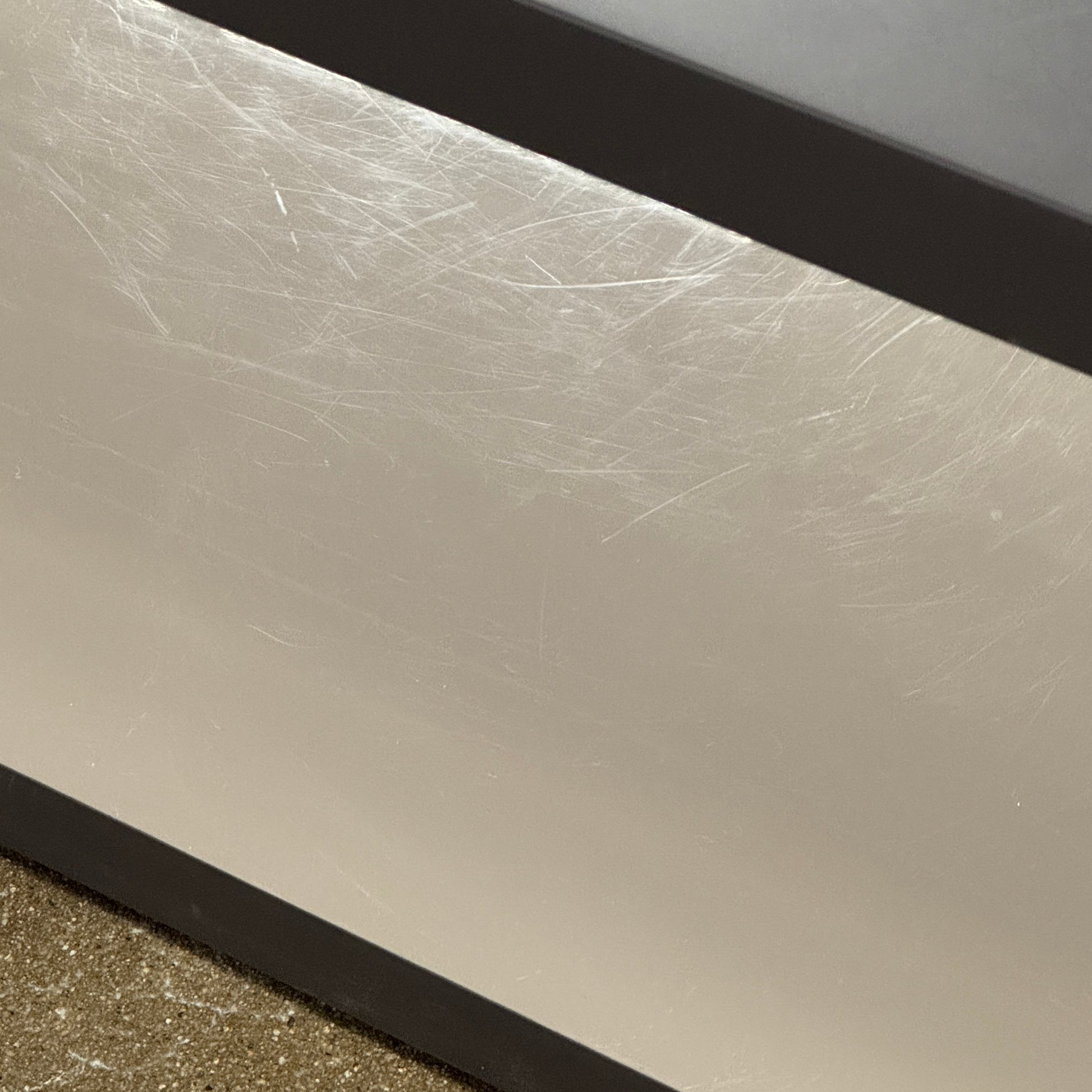 The B&B Italia Frank Low Console by B&B Italia features a sleek black rectangular frame with clear glass, making it an ideal modern low sofa back table inspired by contemporary elegance.