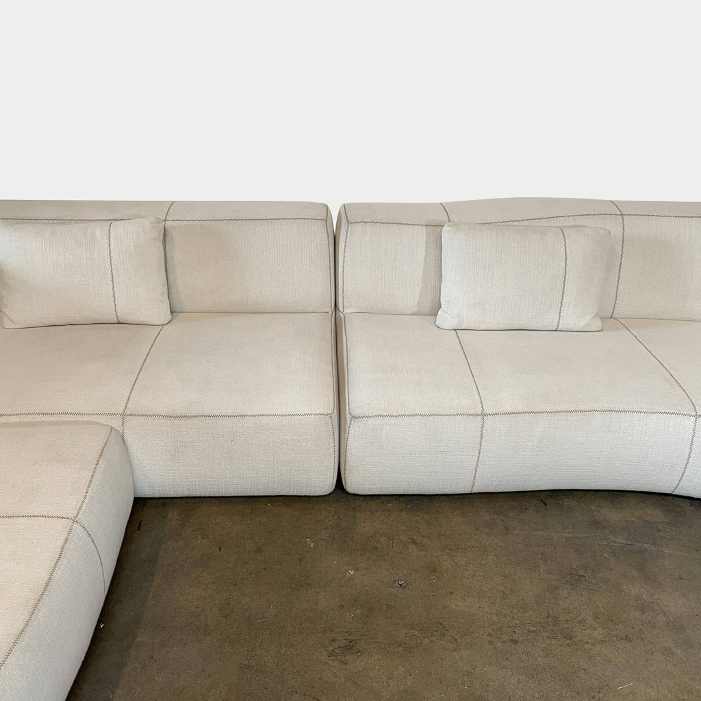 A white B&B Italia Bend Sectional sofa on a white background.