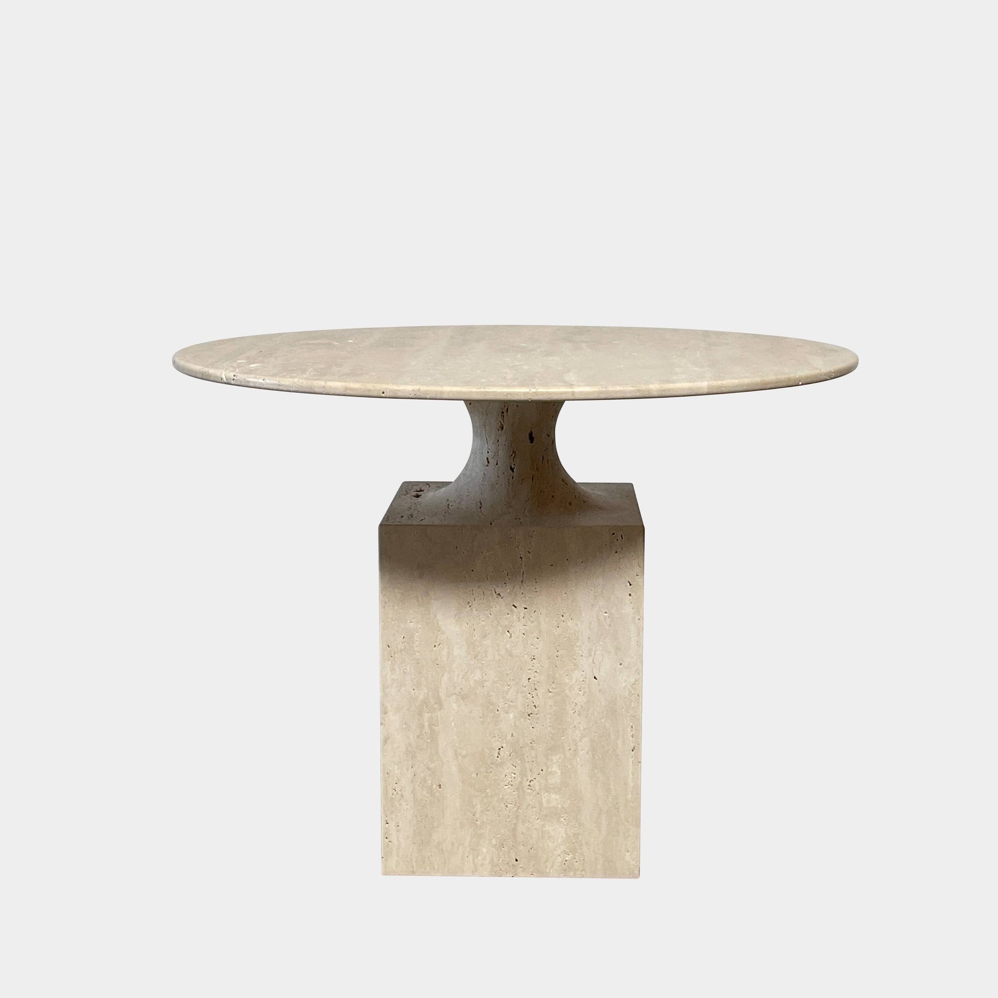A Delcourt Collection Ouk Sylver Travertine Table, handcrafted and imported from France, is displayed on a white background.