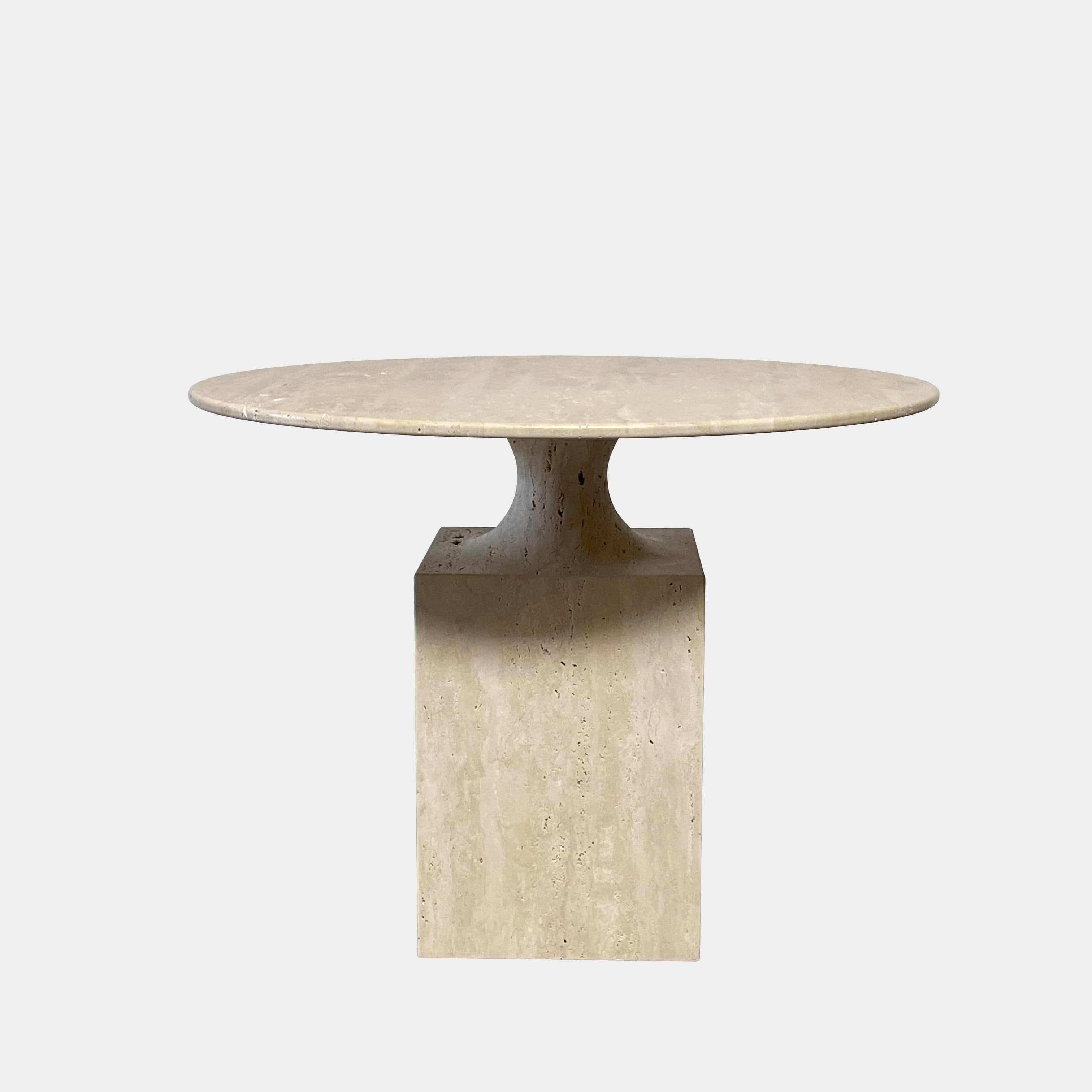 A Delcourt Collection Ouk Sylver Travertine Table, handcrafted and imported from France, is displayed on a white background.