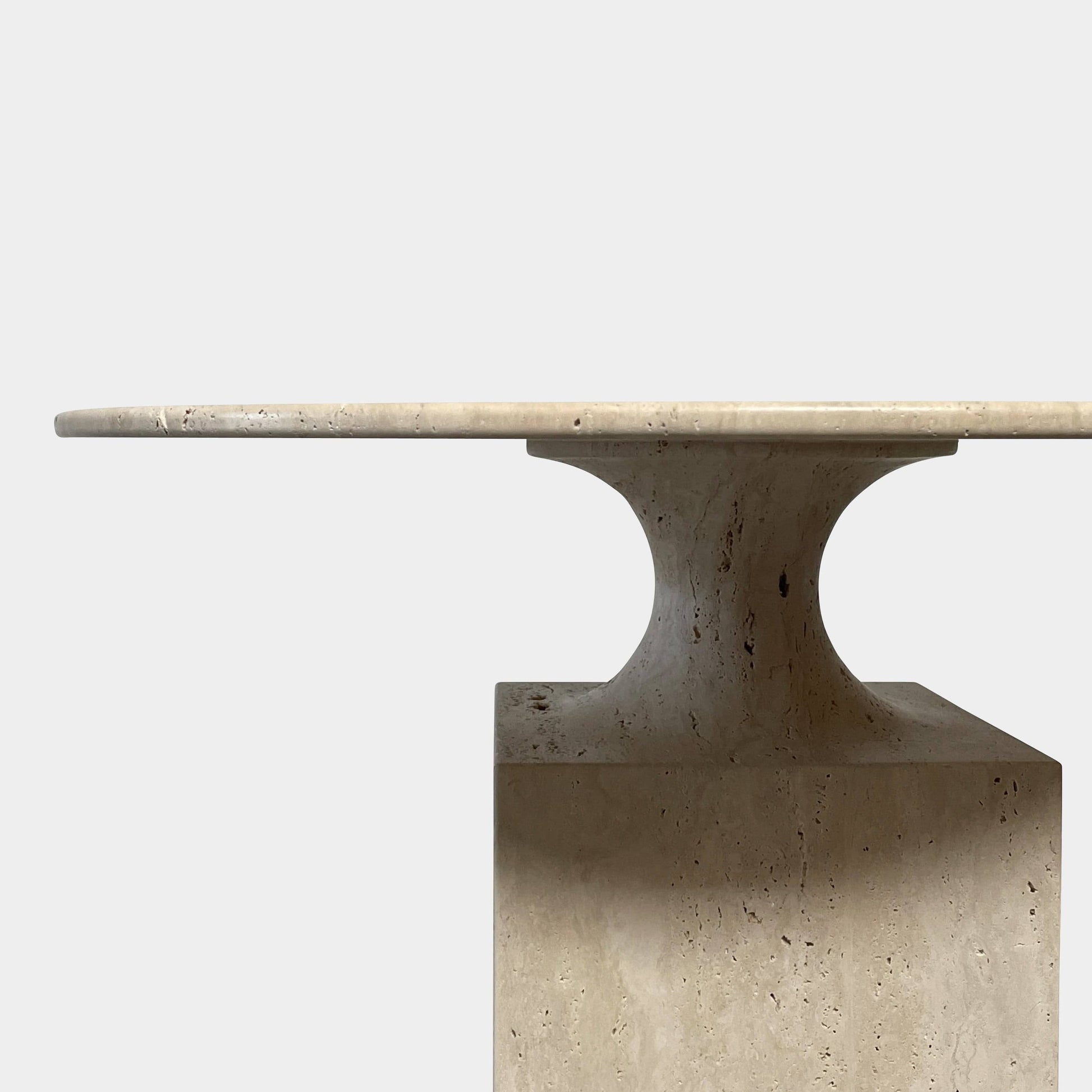 A Delcourt Collection Ouk Sylver Travertine Table, handcrafted and imported from France, is displayed on a white background.