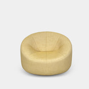 A light yellow Ligne Roset Pumpkin Swivel Lounge Chair with a round shape, low back, and wide seat is shown against a plain white background.