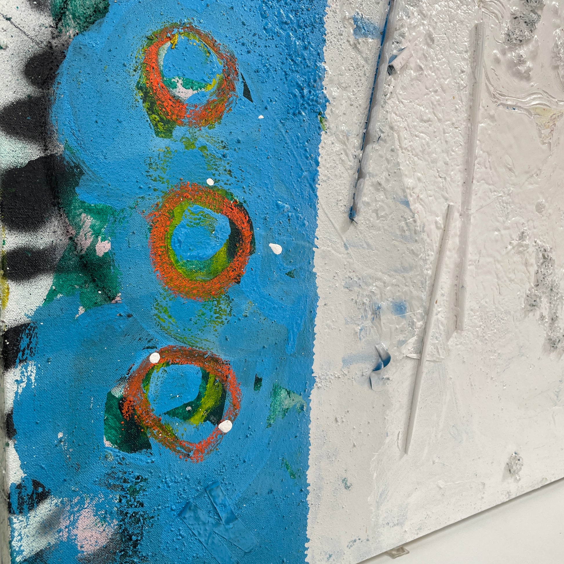 Artist's 'Painting: Variation' by Allison Caesar showcases textured layers of white, blue, with subtle yellow and green. Circular patterns on the left blend collage elements, mixing paint with relief details.