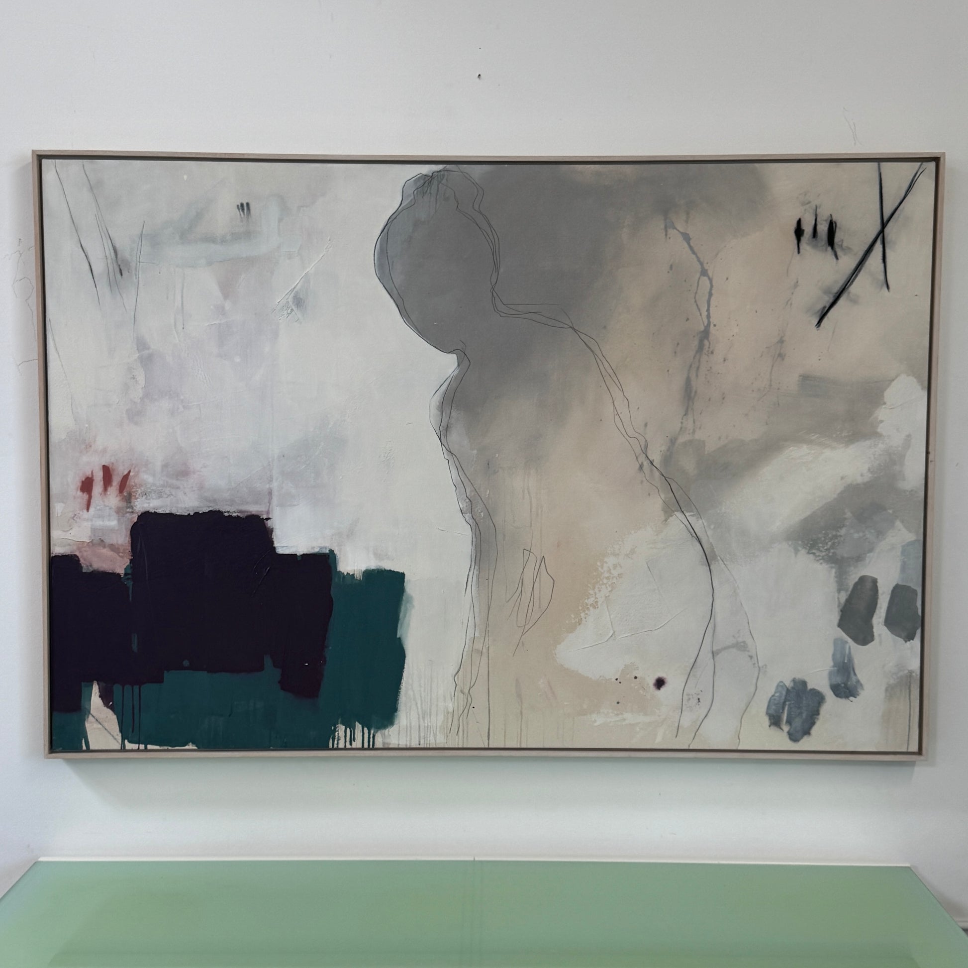 Painting: by Melissa Harrington from Artist showcases textured brushstrokes, a subtle human figure, blocks of dark green and black, with splashes of red and blue on a primarily white and beige background.