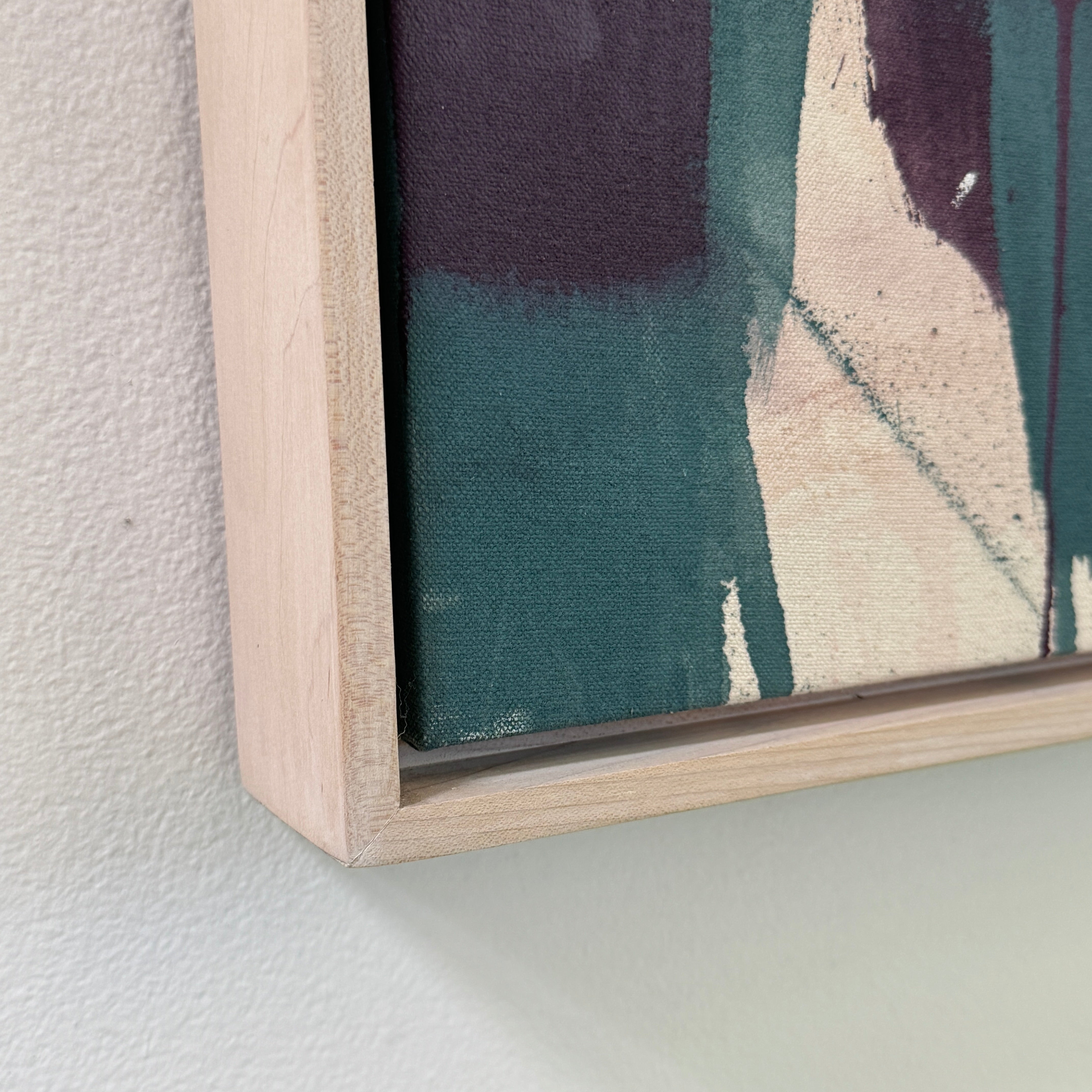 Painting: by Melissa Harrington from Artist showcases textured brushstrokes, a subtle human figure, blocks of dark green and black, with splashes of red and blue on a primarily white and beige background.