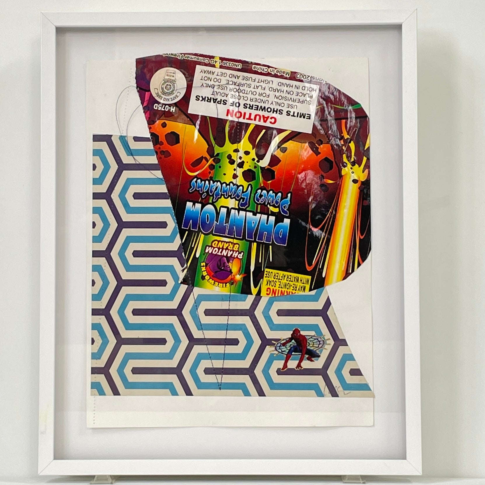 Allison Caesar Mixed Media Framed Collage Number 5 by Modern Resale features a Phantom Punch candy wrapper and geometric blue pattern, with a small Spider-Man figure in the bottom right corner.