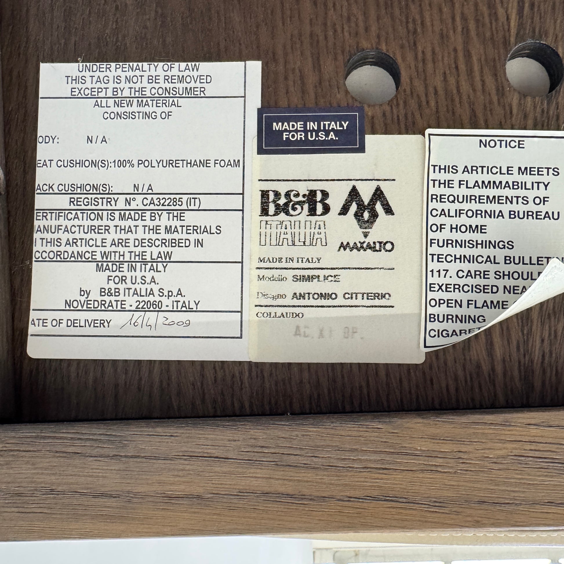 The Maxalto Musa Armchair features a light brown top-grain leather seat and backrest, gray oak wooden frame, and square armrests, set against a plain white background.