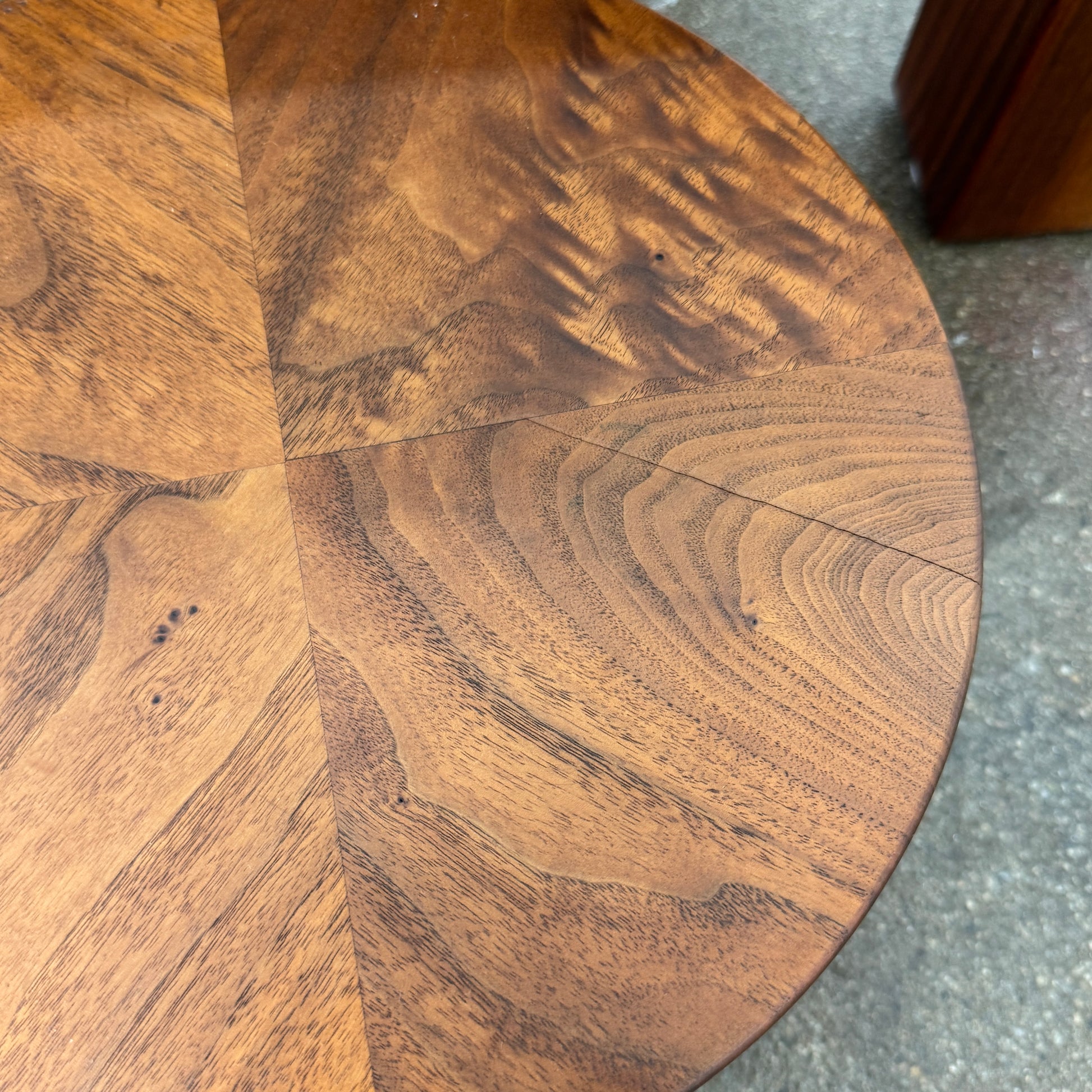 The Marmol Radziner Asher Children's Table and Stools features a square wooden table with four round stools fitting neatly underneath, all by Marmol Radziner, shown against a white background and inspired by their timeless design.