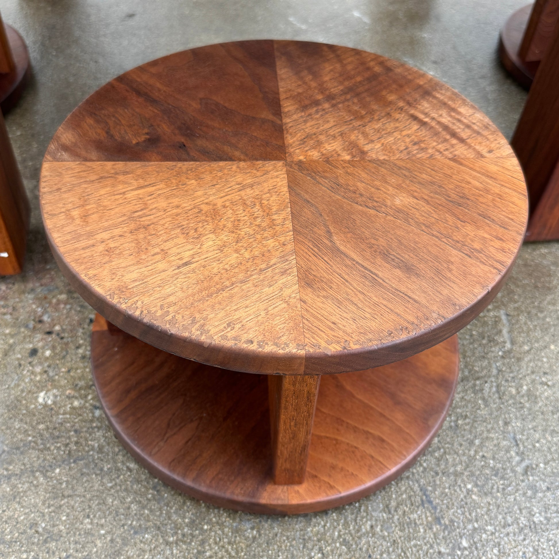 The Marmol Radziner Asher Children's Table and Stools features a square wooden table with four round stools fitting neatly underneath, all by Marmol Radziner, shown against a white background and inspired by their timeless design.