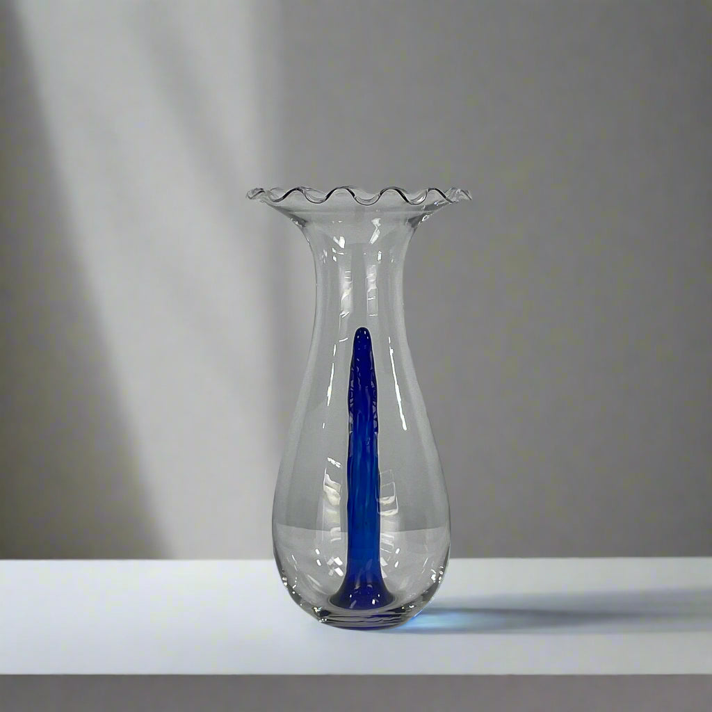 Reminiscent of Philippe Starck's elegance, the Driade Gabriel Vase by Driade showcases a wavy rim and a striking blue vertical streak within its transparent body, capturing sophisticated simplicity.