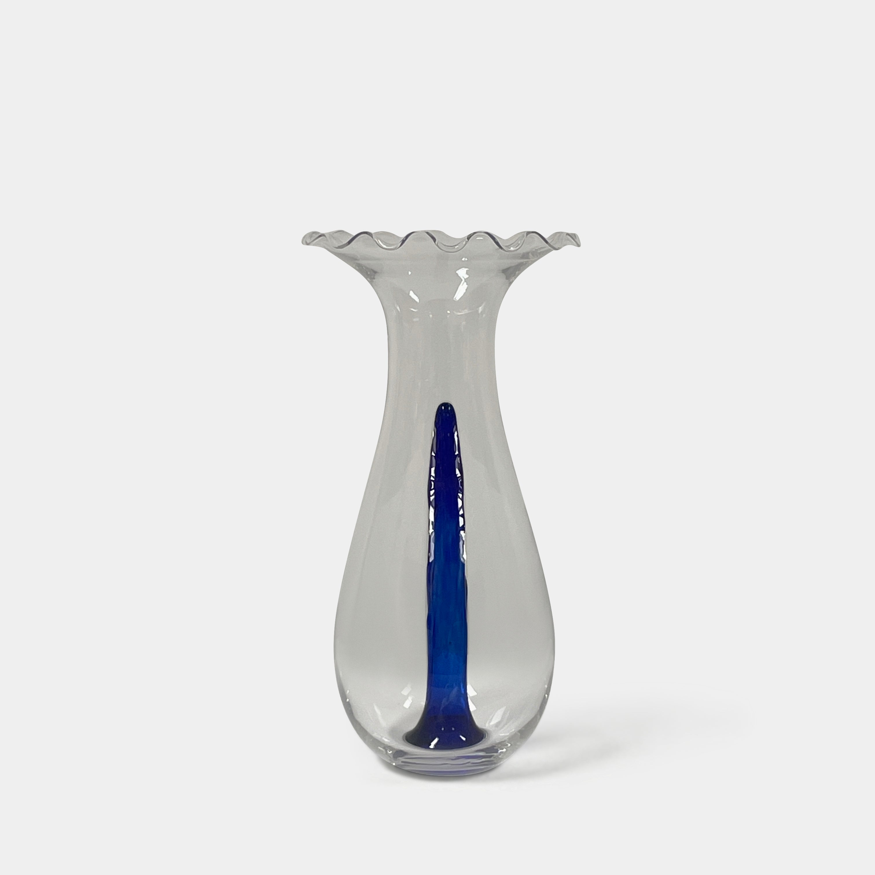 Reminiscent of Philippe Starck's elegance, the Driade Gabriel Vase by Driade showcases a wavy rim and a striking blue vertical streak within its transparent body, capturing sophisticated simplicity.