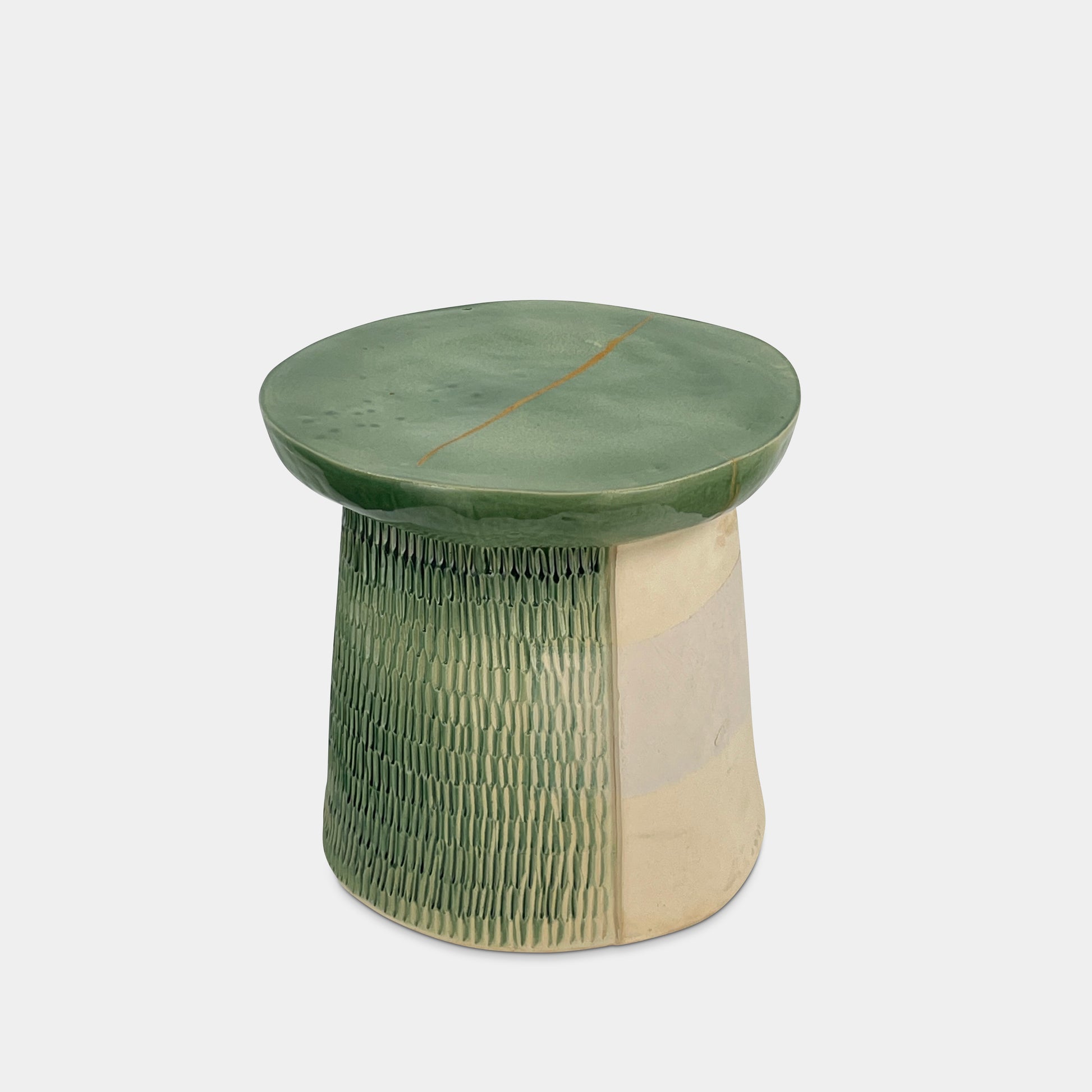 The Artist Allyn Davis Ceramic Side Table in Celadon features a textured cylindrical base and smooth round top, all on a plain white background.