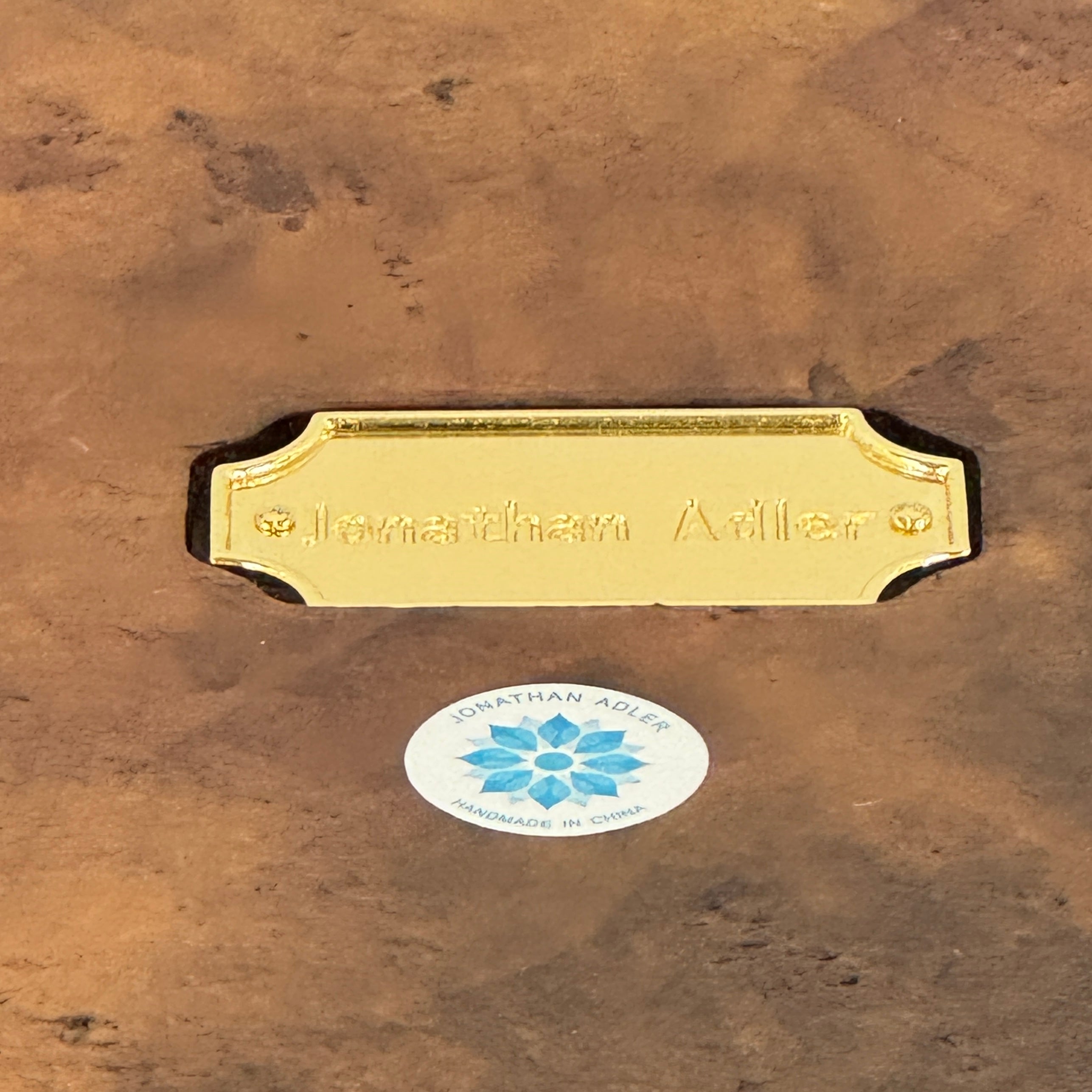 The Jonathan Adler Buenos Aires Side Table features a small round marble top and a sturdy wooden base, shown against a plain white background.