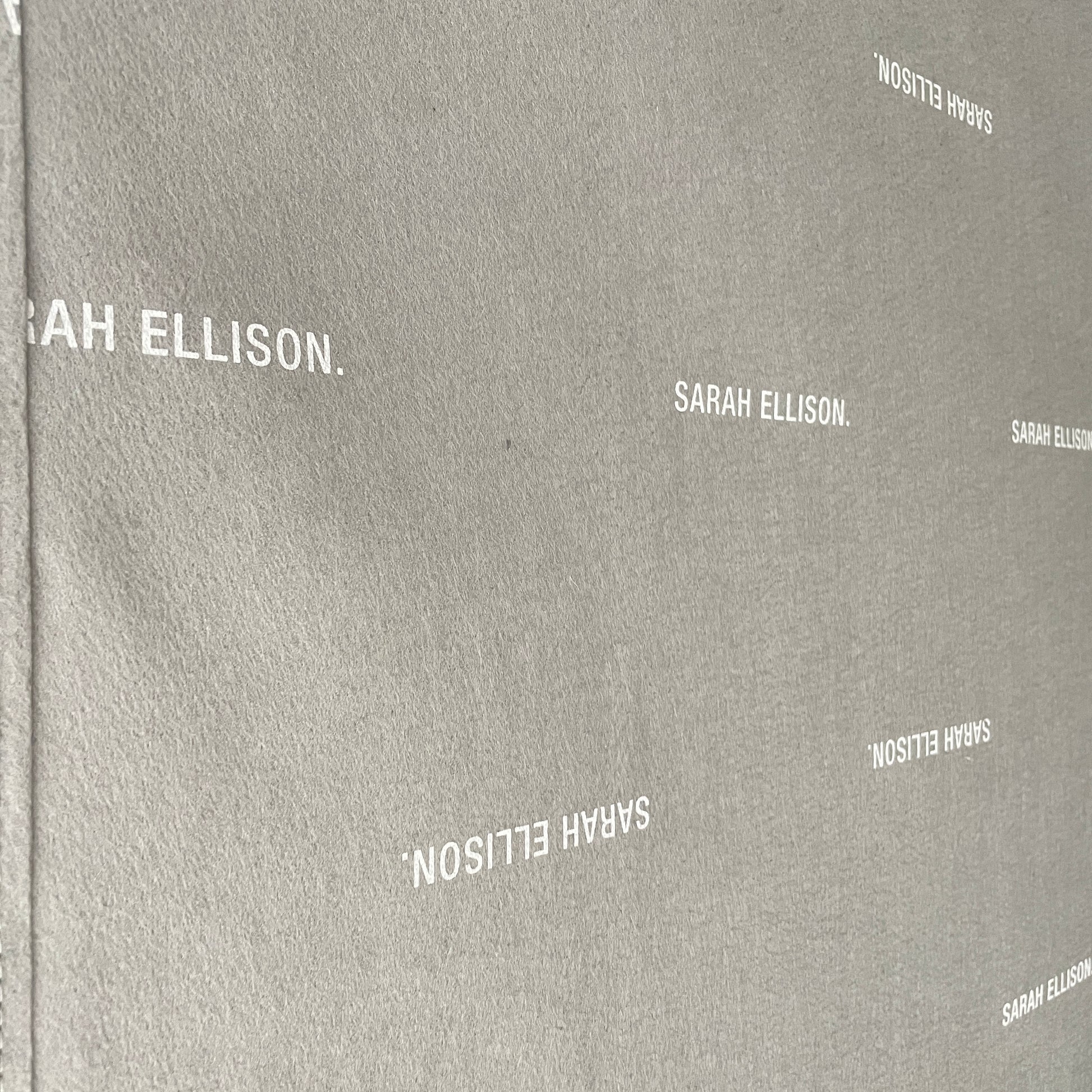 The Ellison Studios Float Sofa is a dark brown sectional from Ellison Studios with velvet upholstery, low profile, channel tufting, and two large cushions for extra comfort.
