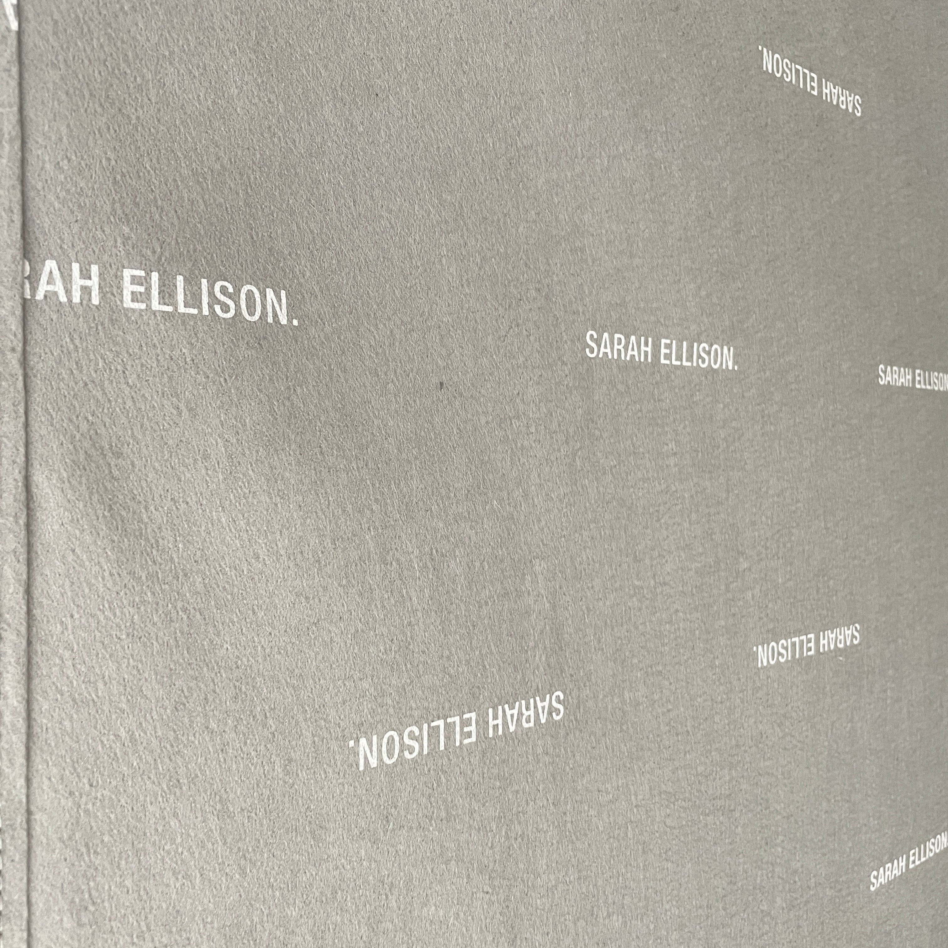 The Ellison Studios Float Sofa is a dark brown sectional from Ellison Studios with velvet upholstery, low profile, channel tufting, and two large cushions for extra comfort.