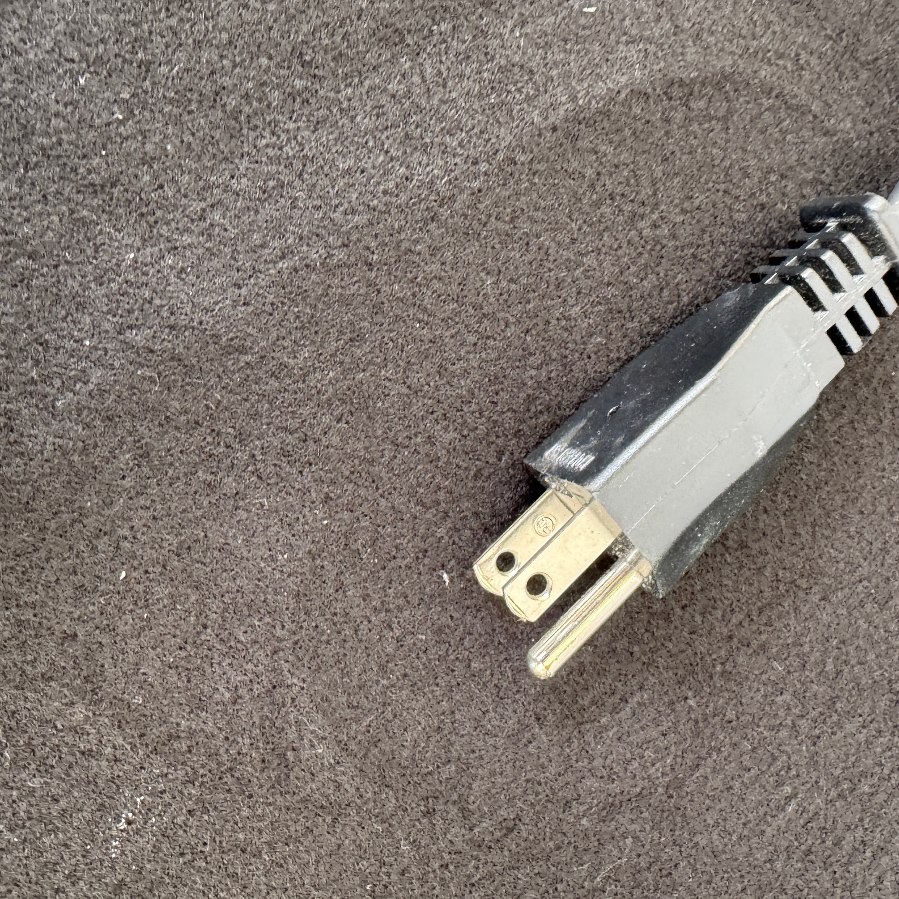 The Martinelli Luce Pipistrello Table Lamp by Martinelli Luce features a black base, silver neck, and white dome-shaped shade, shown against a plain white background with visible power cord and tag.