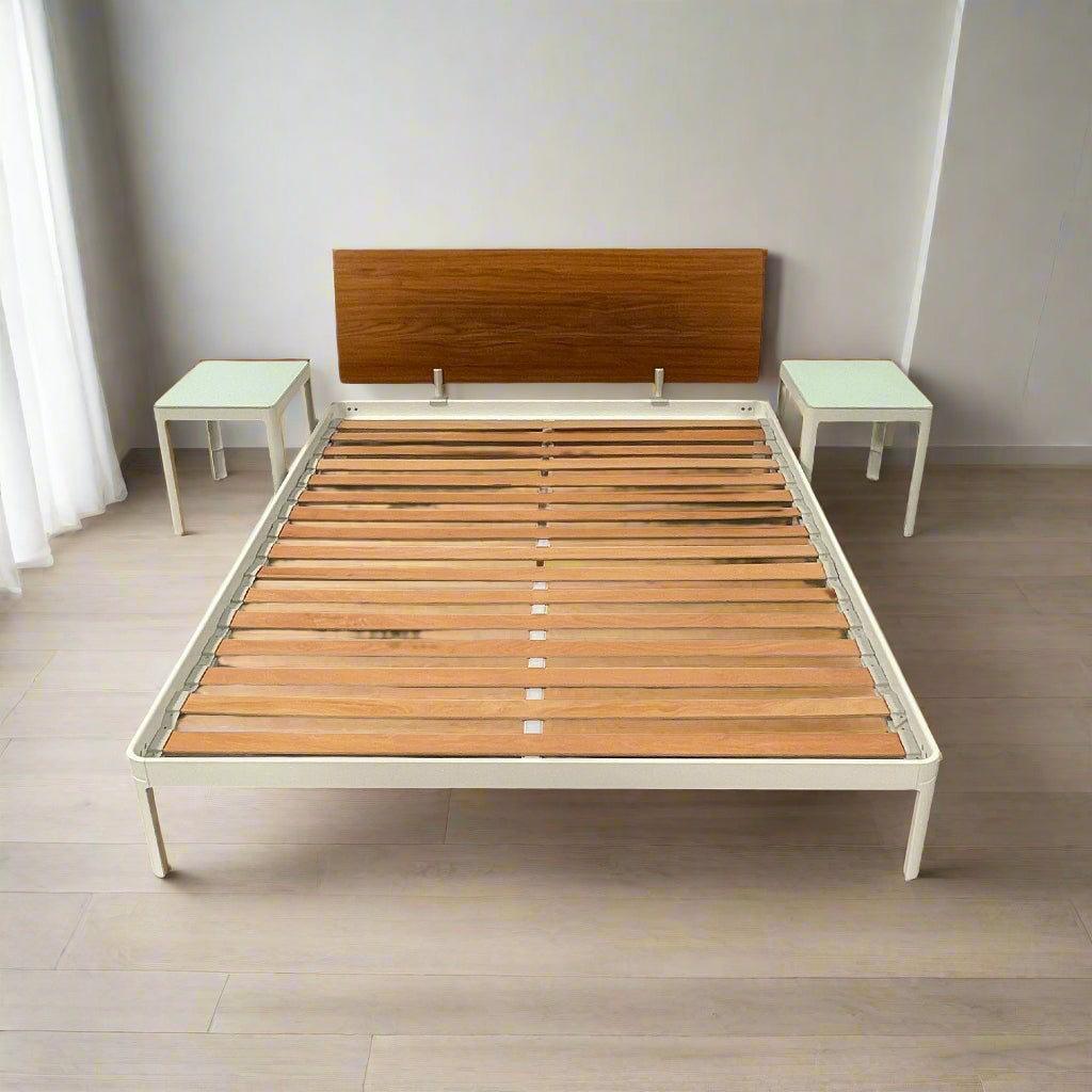 The DWR Min Queen Size Bed by Luciano Bertoncini showcases a metal frame with a sophisticated wooden headboard and slatted wooden base, elegantly placed against a plain white background.