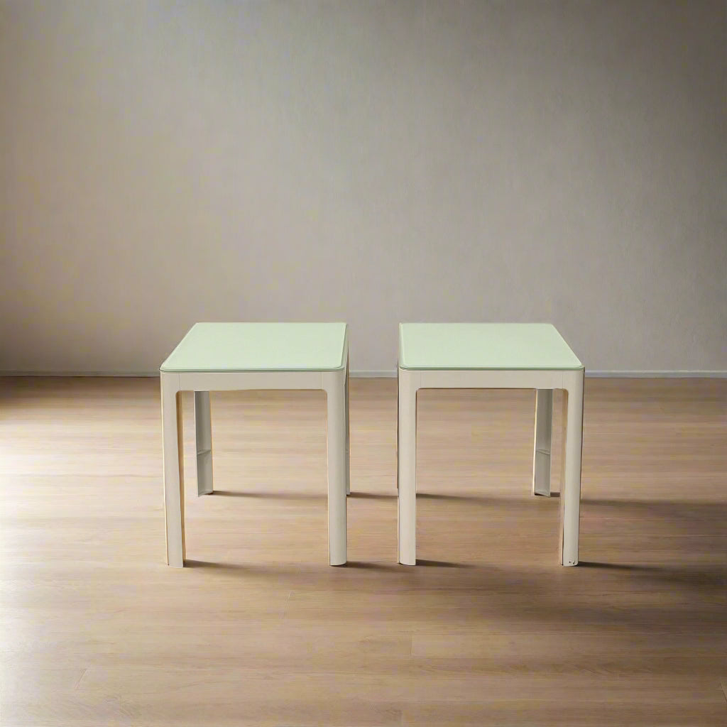 Two DWR Min Night Tables in green from the Modern Resale Min Collection, designed by an Italian designer, are set against a white background.