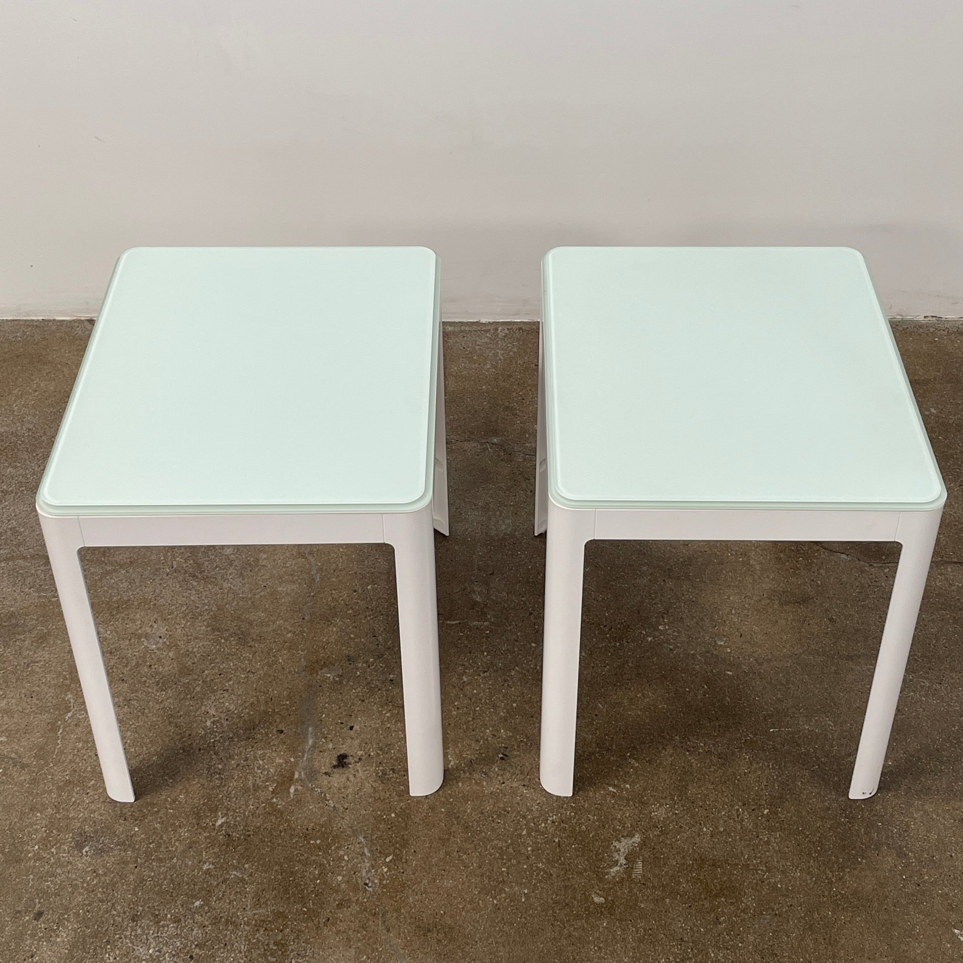 Two DWR Min Night Tables in green from the Modern Resale Min Collection, designed by an Italian designer, are set against a white background.