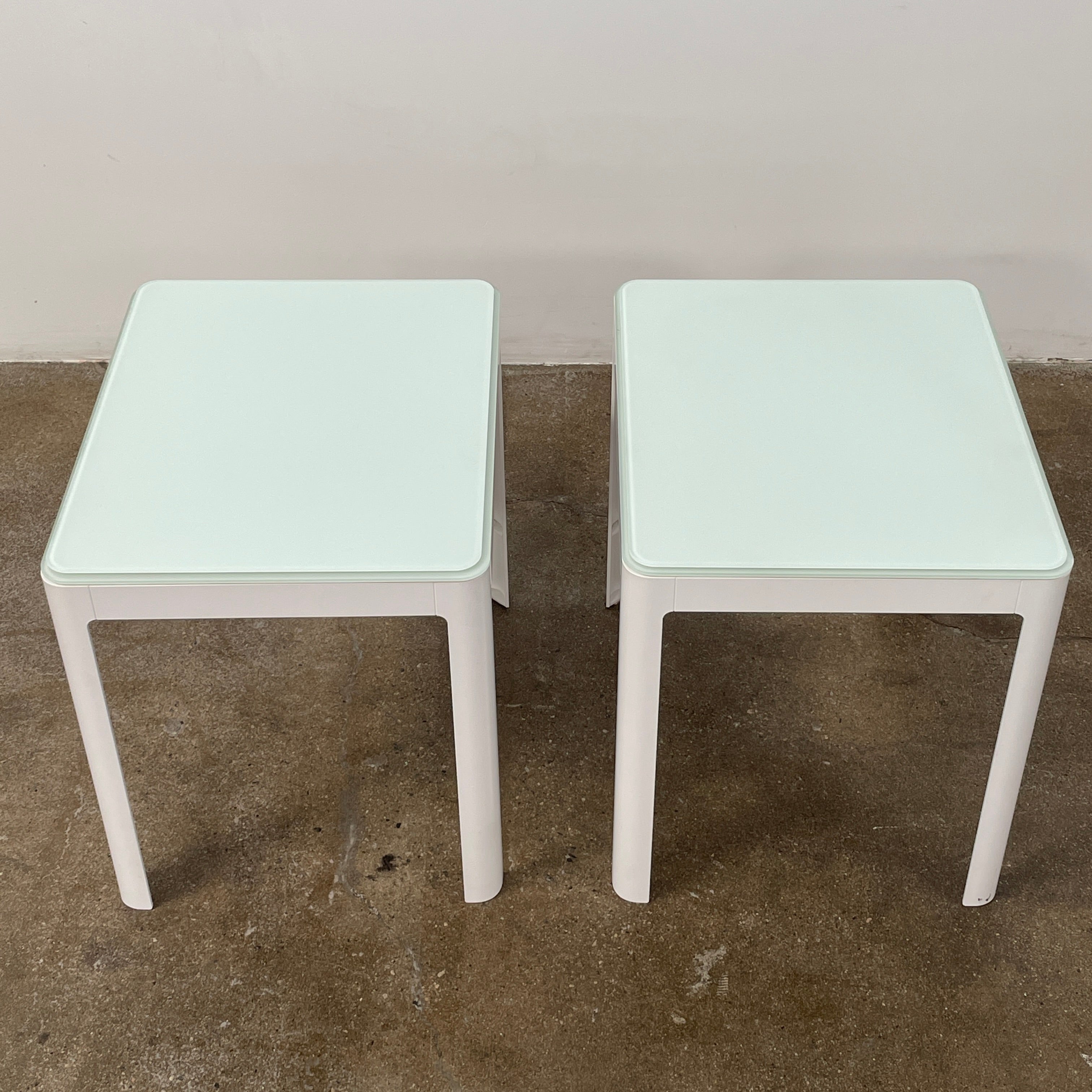 Two DWR Min Night Tables in green from the Modern Resale Min Collection, designed by an Italian designer, are set against a white background.