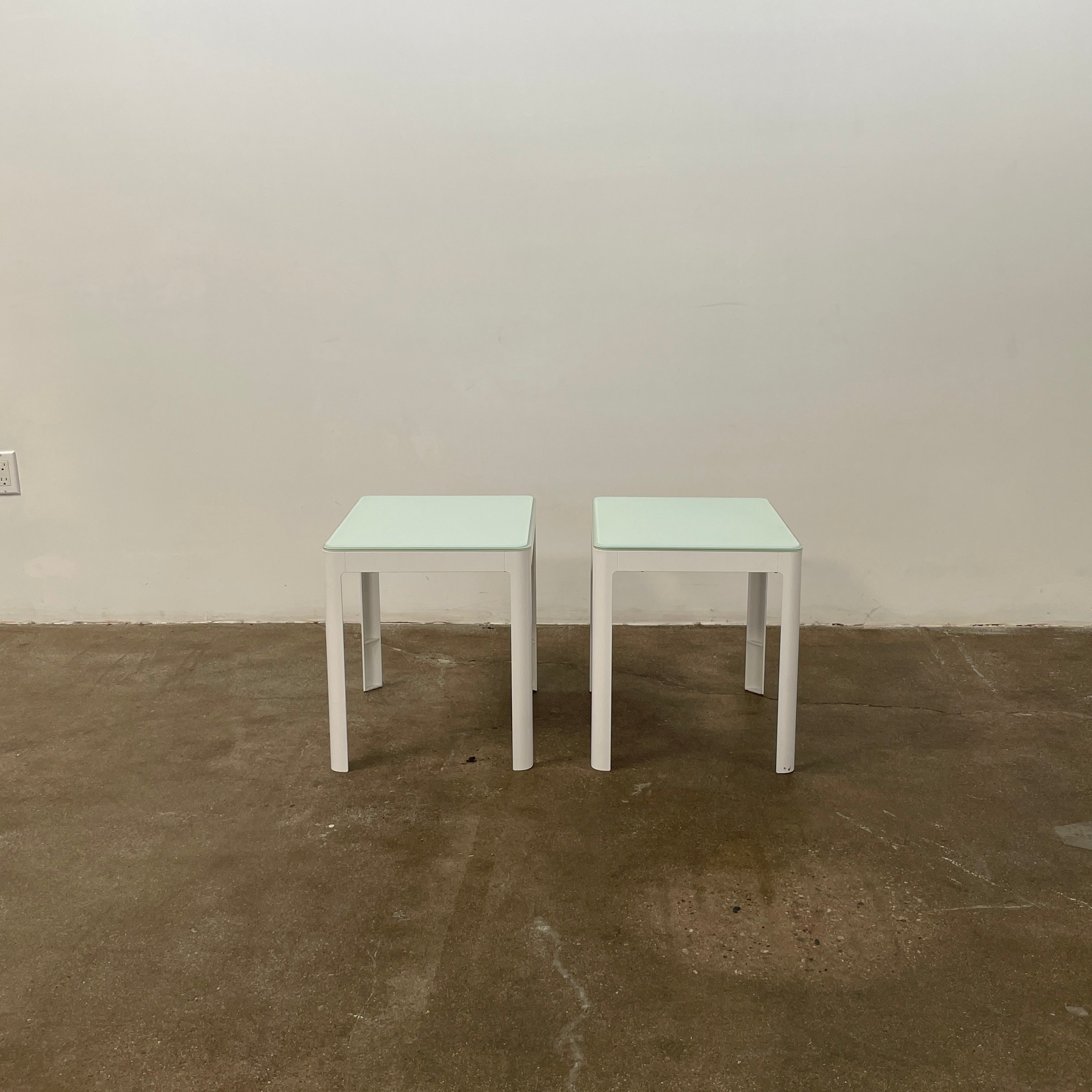 Two DWR Min Night Tables in green from the Modern Resale Min Collection, designed by an Italian designer, are set against a white background.