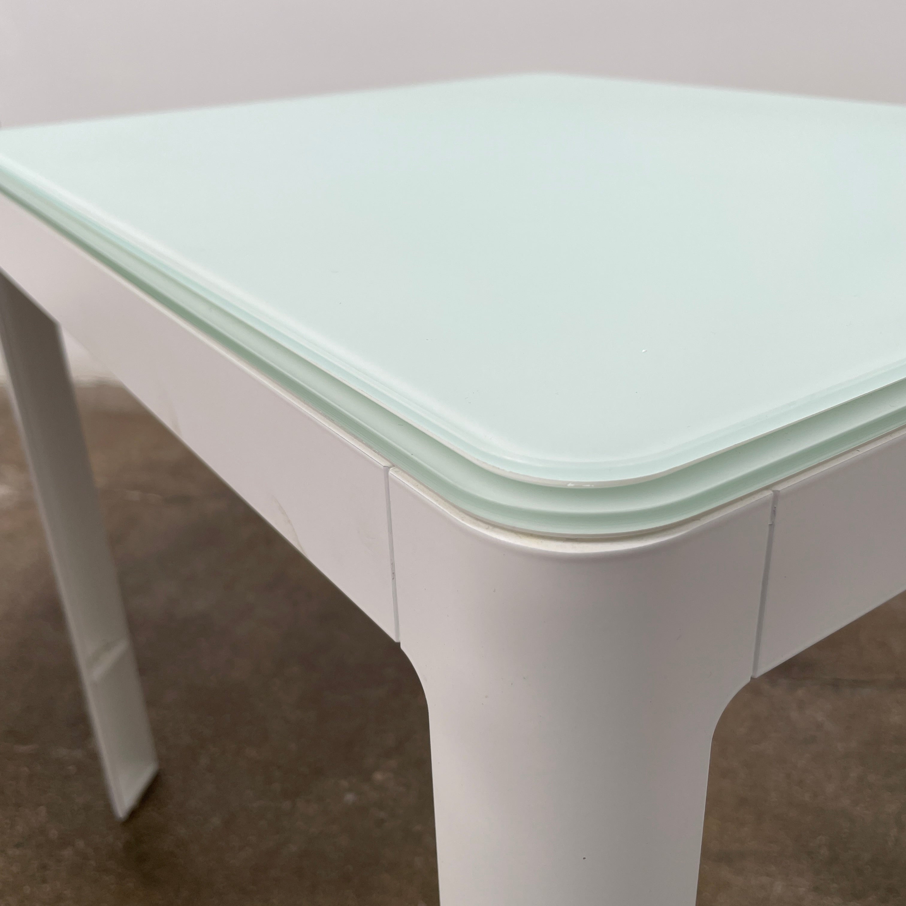 Two DWR Min Night Tables in green from the Modern Resale Min Collection, designed by an Italian designer, are set against a white background.