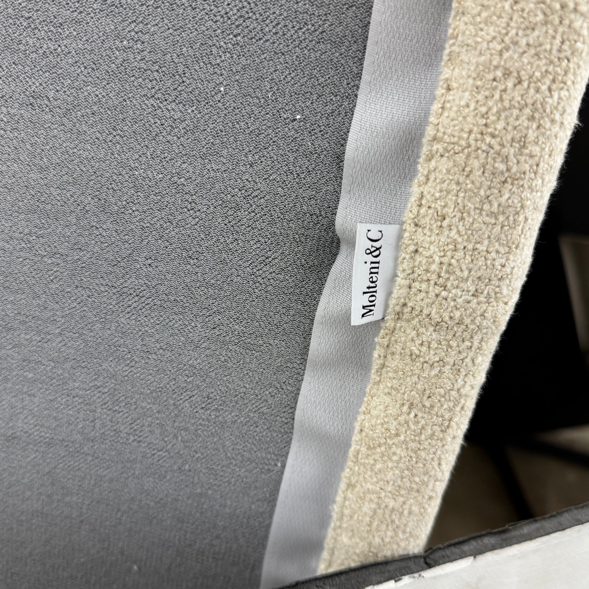 The Molteni & C Marteen Sofa is a modern beige sofa with wide armrests and two rectangular brown back cushions, featuring linen blend upholstery. Shown from the front on a white background.