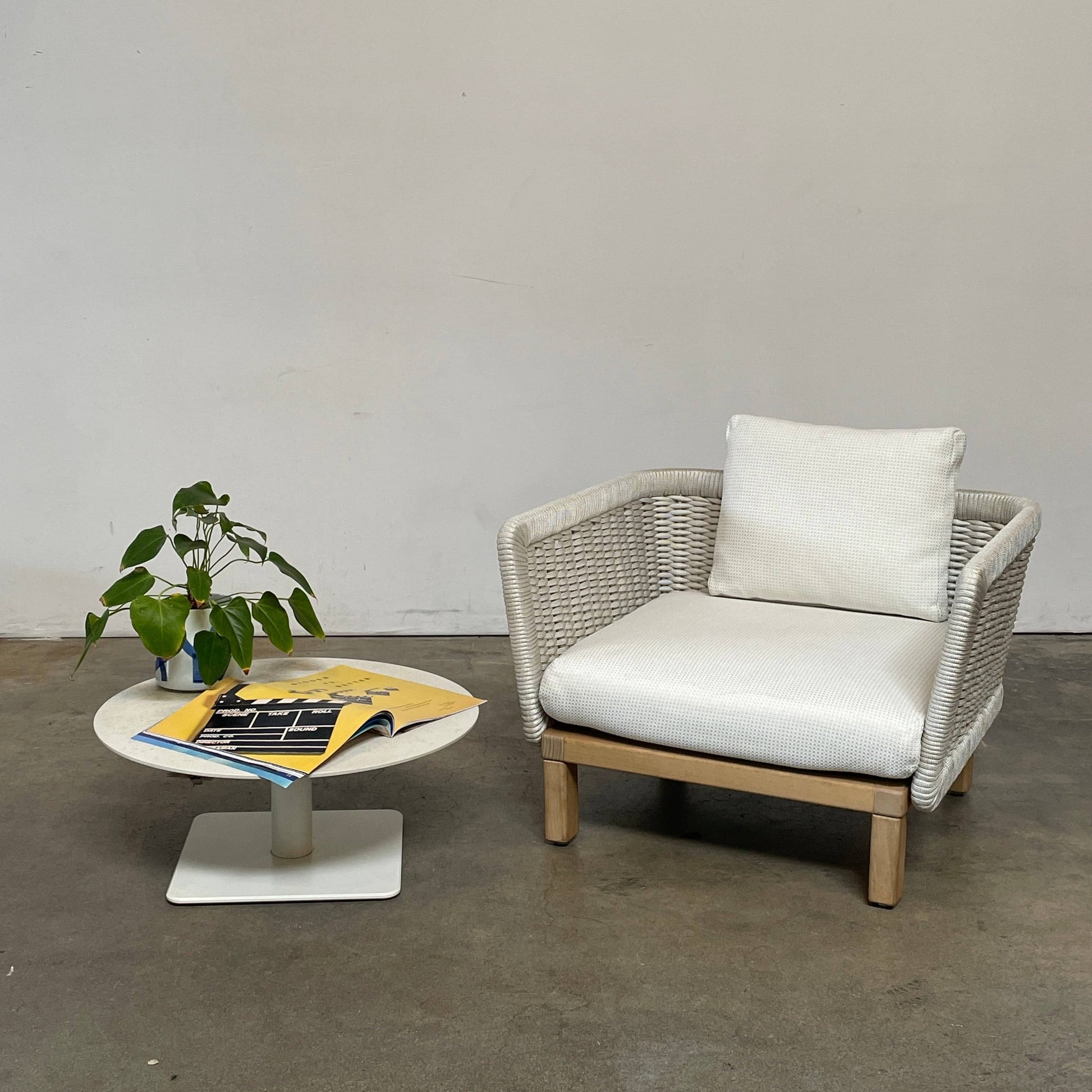 An adjustable-height Paola Lenti Giro Outdoor Side Table for outdoor living, displayed on a white background.