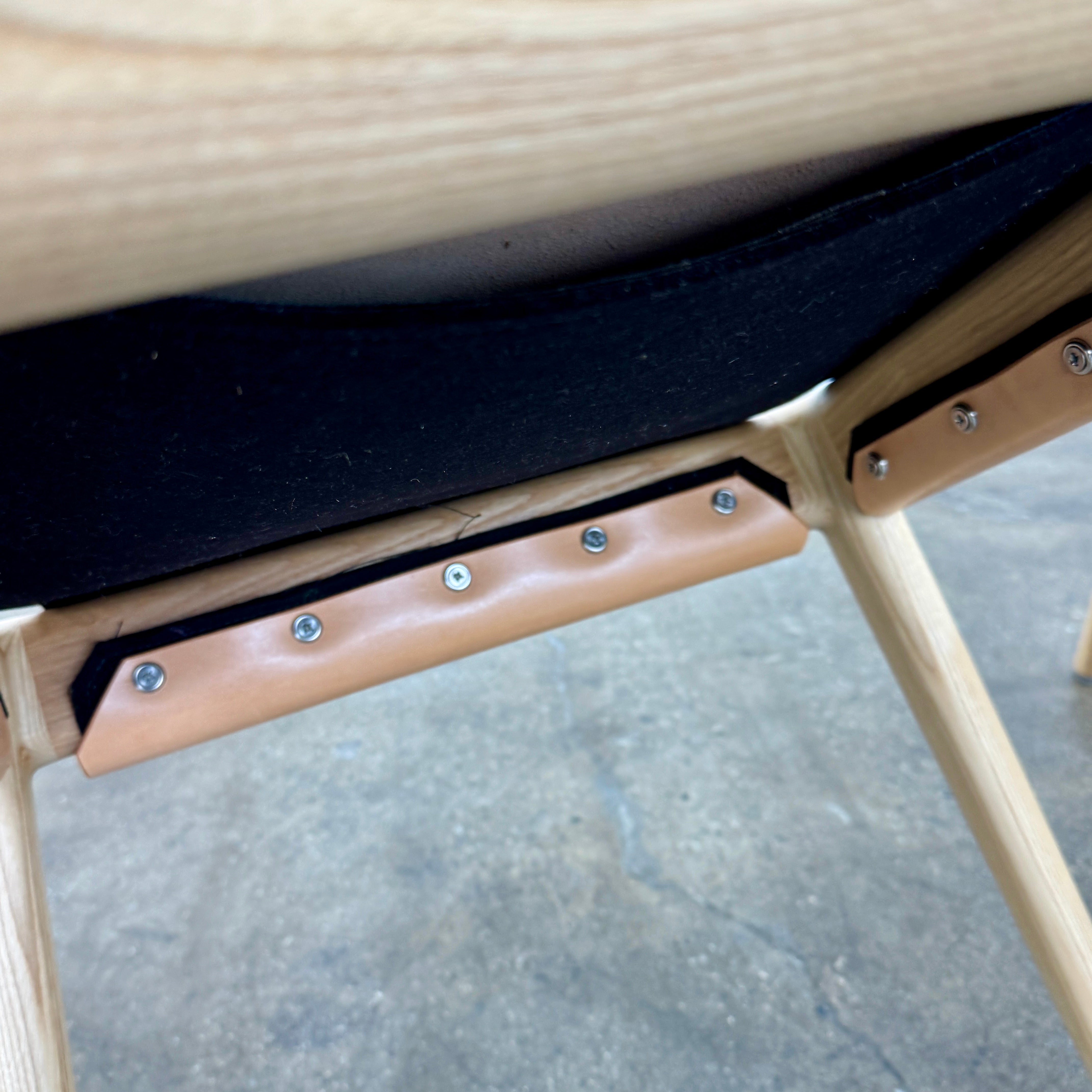 The Tom Feraday Pieman Dining Chair Set of 4 features Hydrowood timber frames and light brown leather seats and backs, offering a perfect blend of elegance and comfort. All four chairs are shown in two rows against a plain white background.