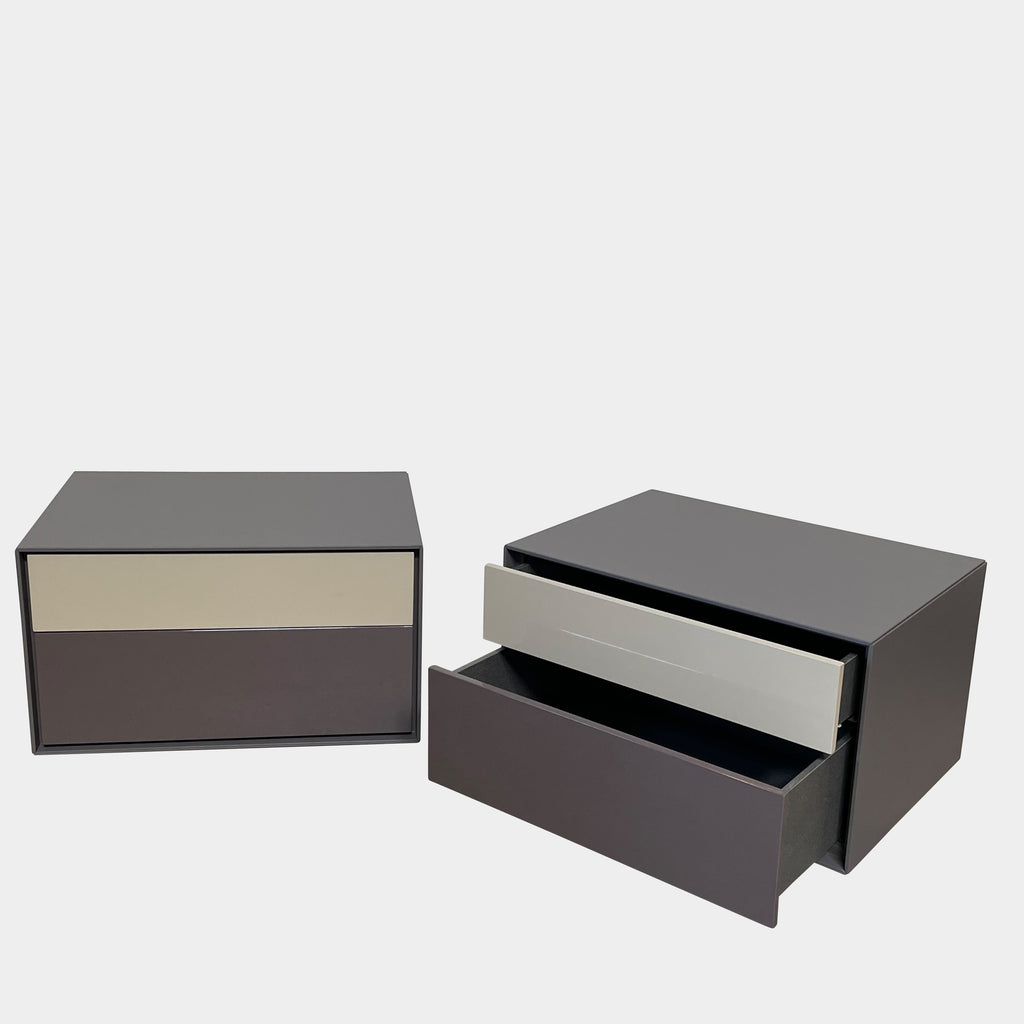 Two black B&B Italia Dado Nightstands with a modern touch on a white background.